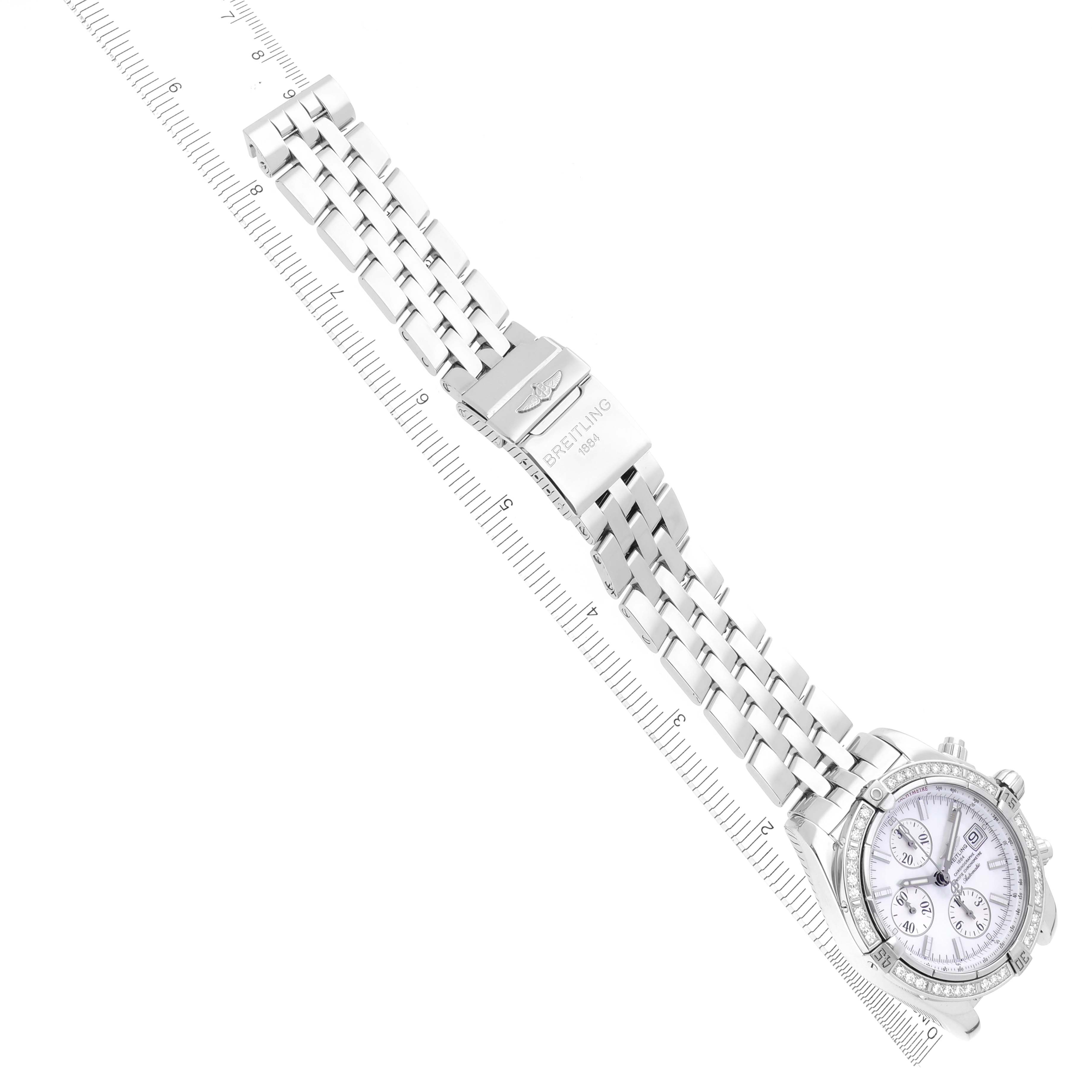 The Breitling Chronomat A13356 Men's Stainless Steel Mother of Pearl Dial A13356 Men's Stainless Steel Mother of Pearl Dial watch is shown from a top-down angle, displaying the bracelet and face fully extended.