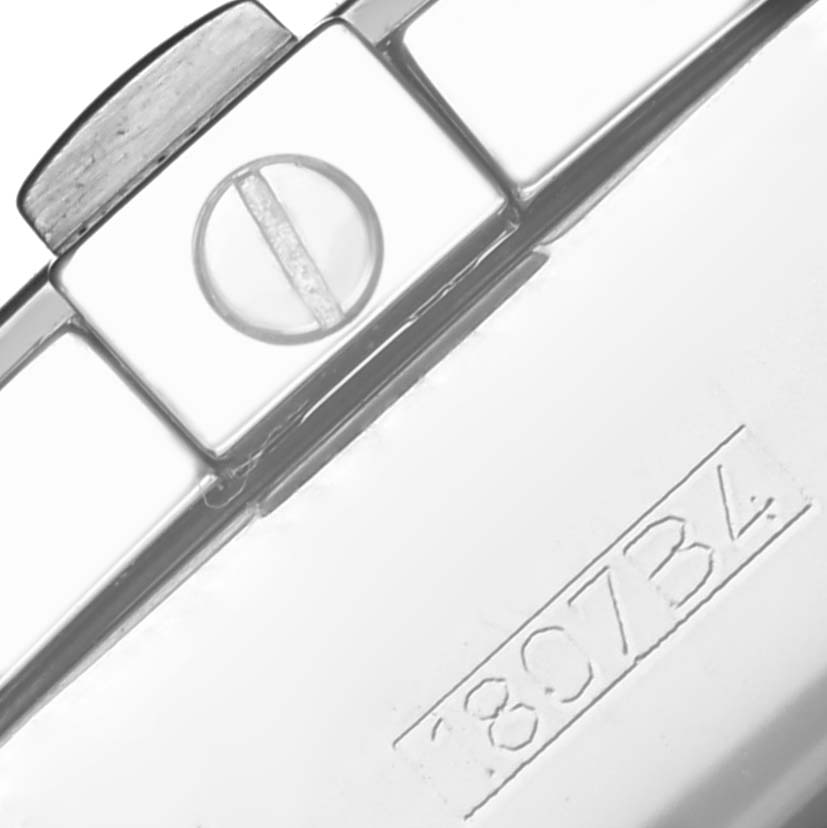 The image shows a close-up of a clasp and serial number on the Breitling Chronomat A13356 Men's Stainless Steel Mother of Pearl Dial A13356 Men's Stainless Steel Mother of Pearl Dial watch bracelet.