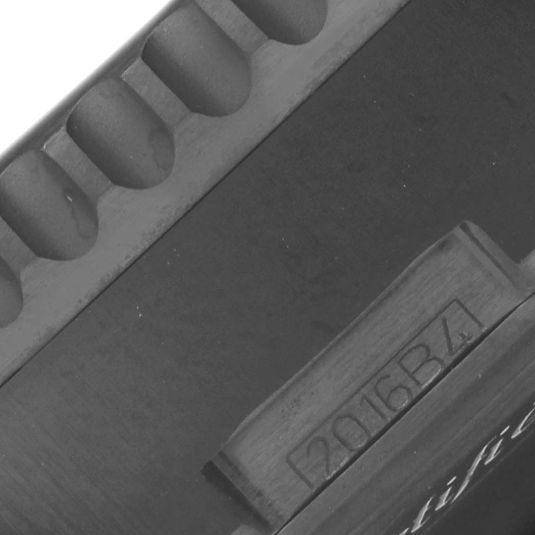 The image shows a close-up of the side of a Breitling Navitimer MB012822/BE51 Men
s Stainless Steel Black Dial MB012822/BE51 Men
s Stainless Steel Black Dial, highlighting the bezel and engraved details.