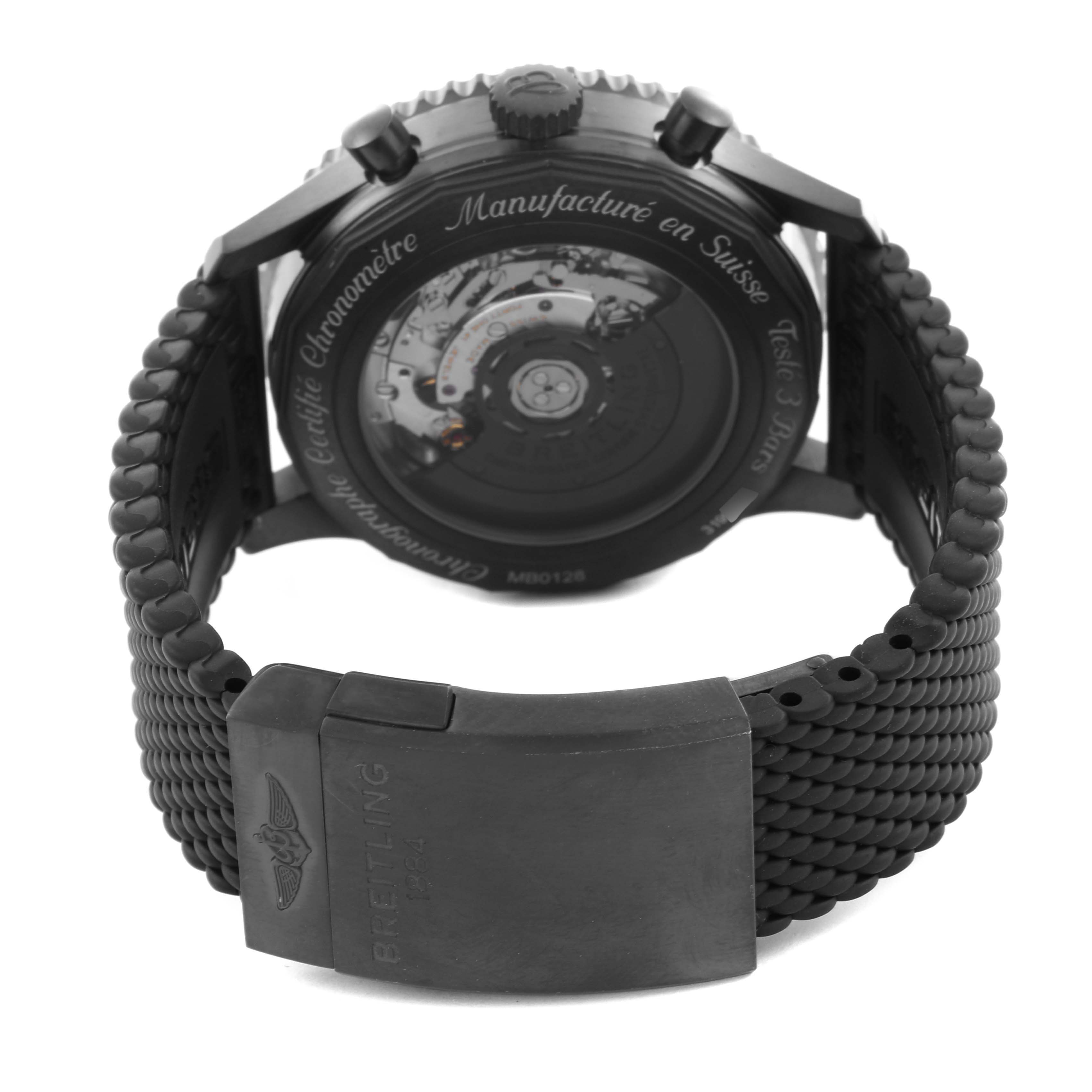 The Breitling Navitimer MB012822/BE51 Men
s Stainless Steel Black Dial MB012822/BE51 Men
s Stainless Steel Black Dial watch is shown from the back, highlighting its case back and clasp on the woven strap.