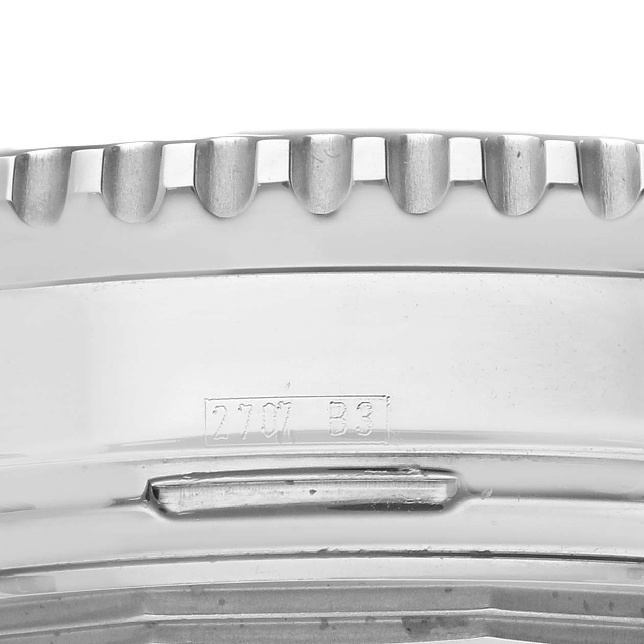 The image shows a close-up side view of the bezel and part of the case of a Breitling Navitimer A23322 Men
s Stainless Steel Blue Dial A23322 Men
s Stainless Steel Blue Dial watch.