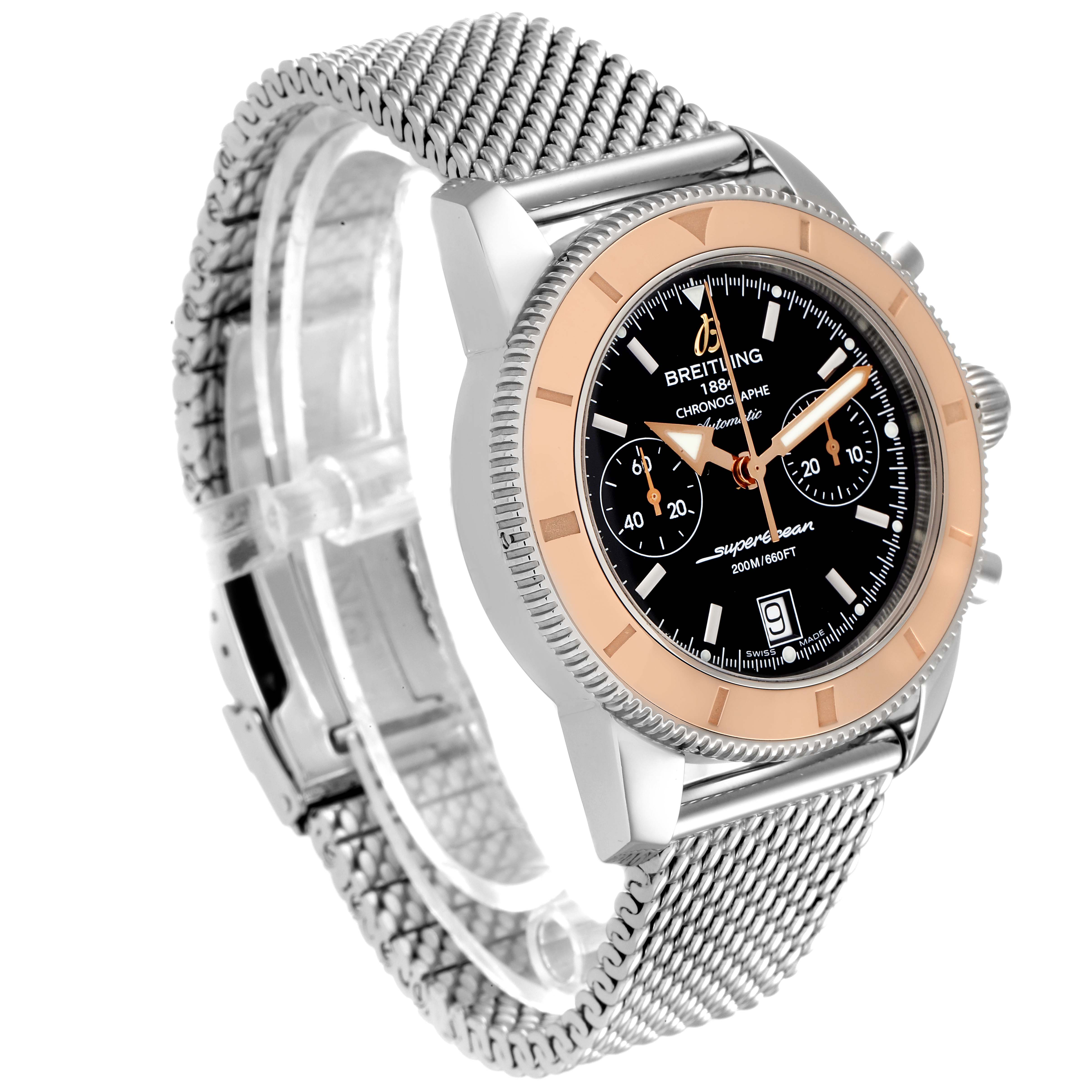 The image shows a Breitling Superocean U23370 Men
s Steel and Gold (two tone) Black Dial U23370 Men
s Steel and Gold (two tone) Black Dial watch at a three-quarter angle, highlighting the dial, bezel, and mesh strap.