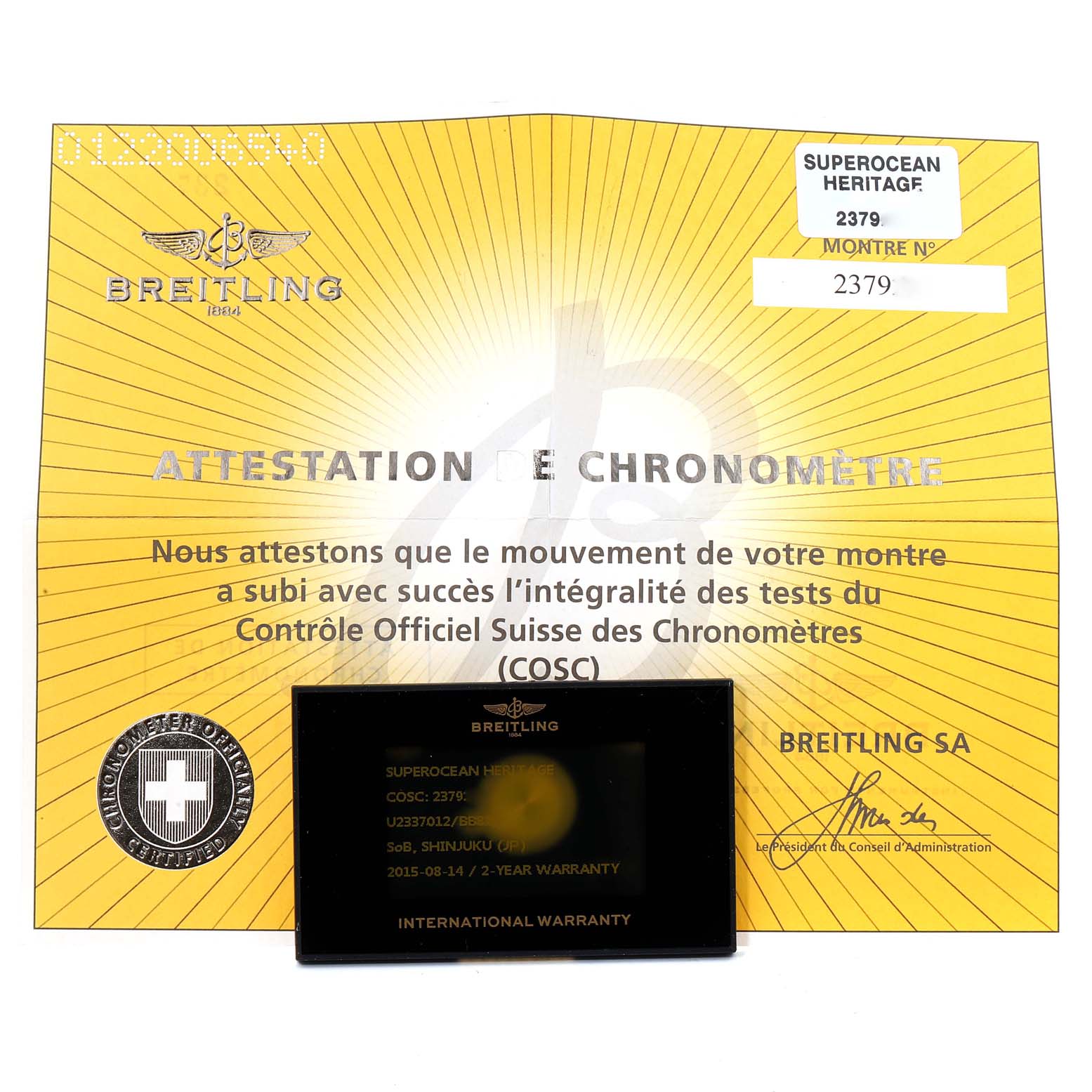 The image shows the Breitling Superocean U23370 Men
s Steel and Gold (two tone) Black Dial U23370 Men
s Steel and Gold (two tone) Black Dial Heritage certification and international warranty card.