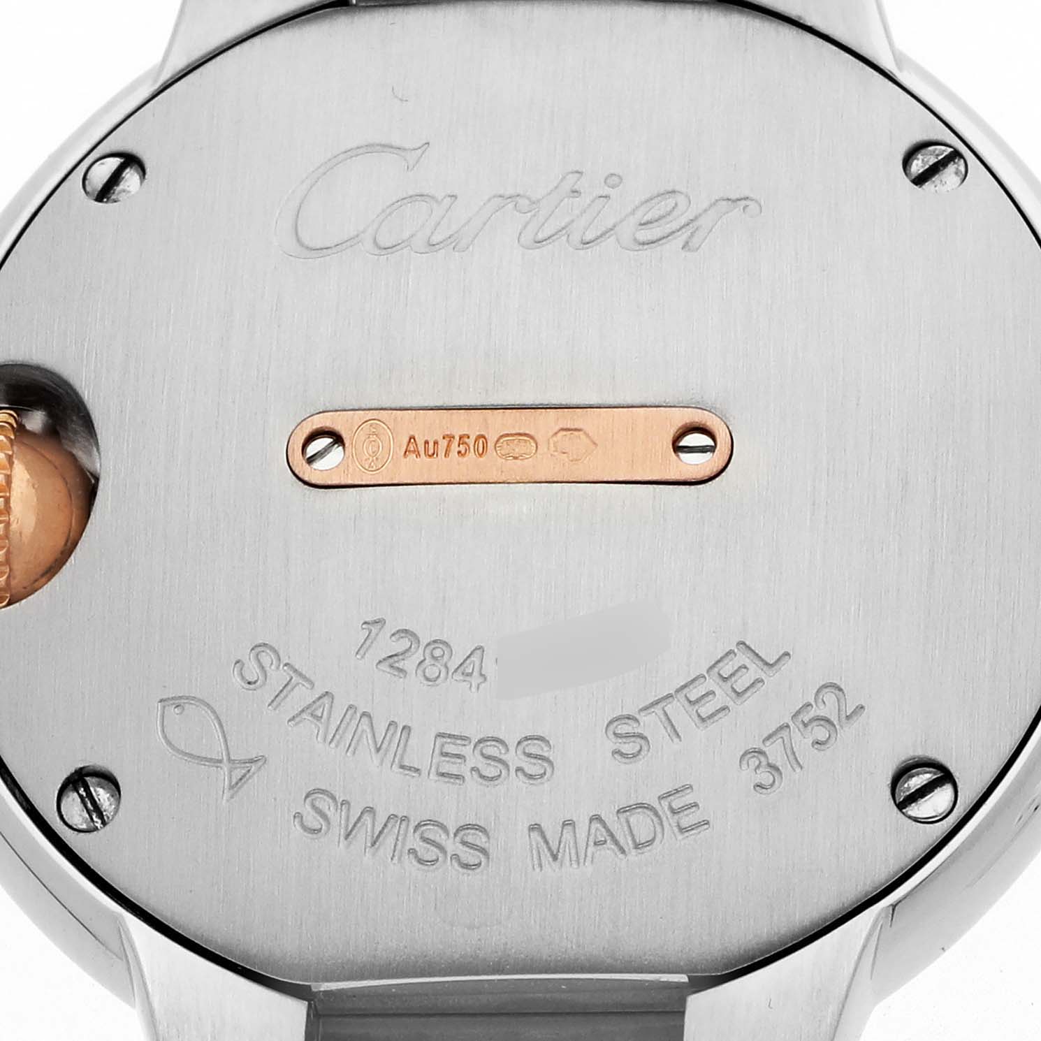 The image shows the back of a Cartier Ballon Bleu W3BB0009 Women's Steel and Gold (two tone) Silver Dial watch, highlighting the embossed brand name and material details.