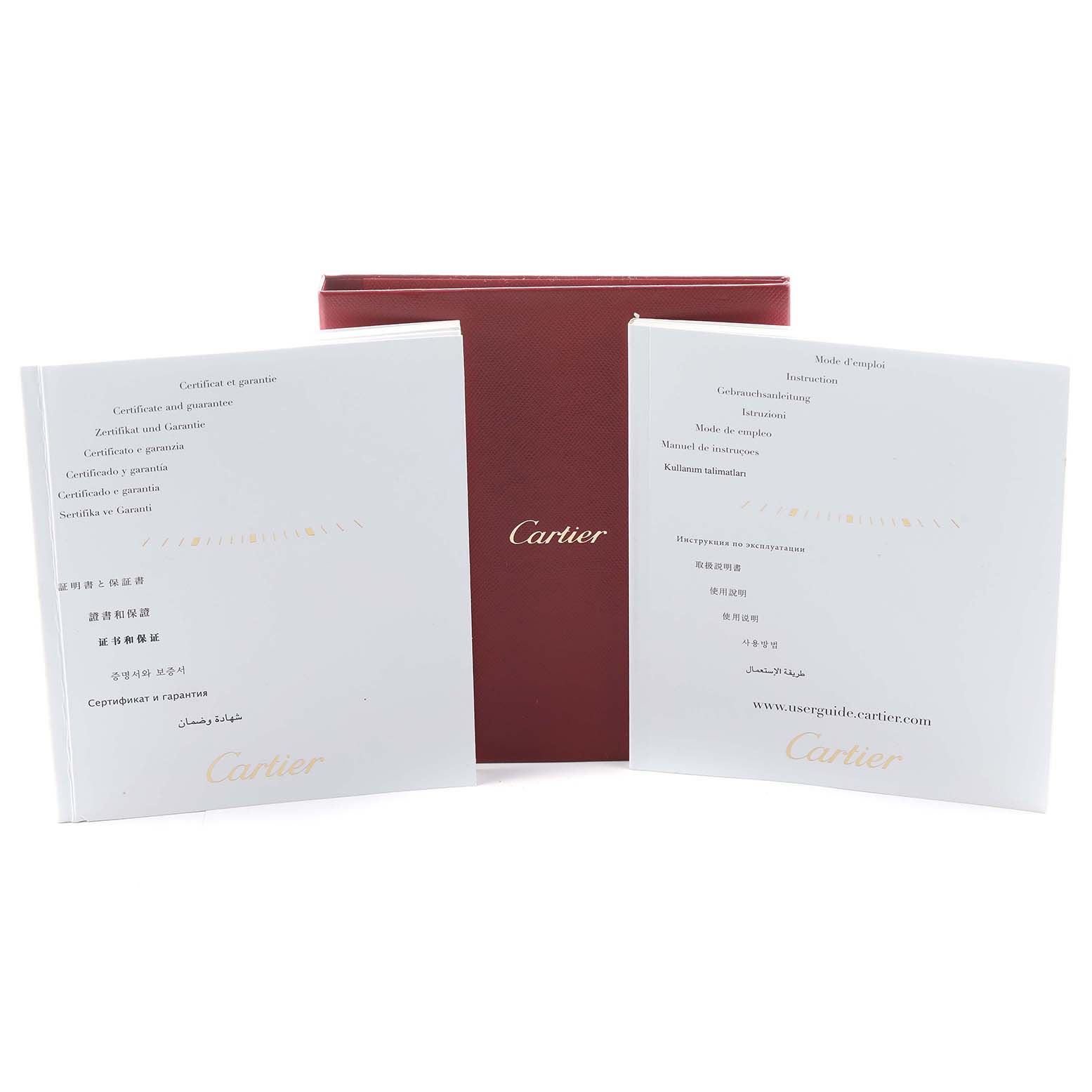 This image shows the warranty and instruction booklets for the Cartier Ballon Bleu W3BB0009 Women's Steel and Gold (two tone) Silver Dial with a red Cartier box in the background.