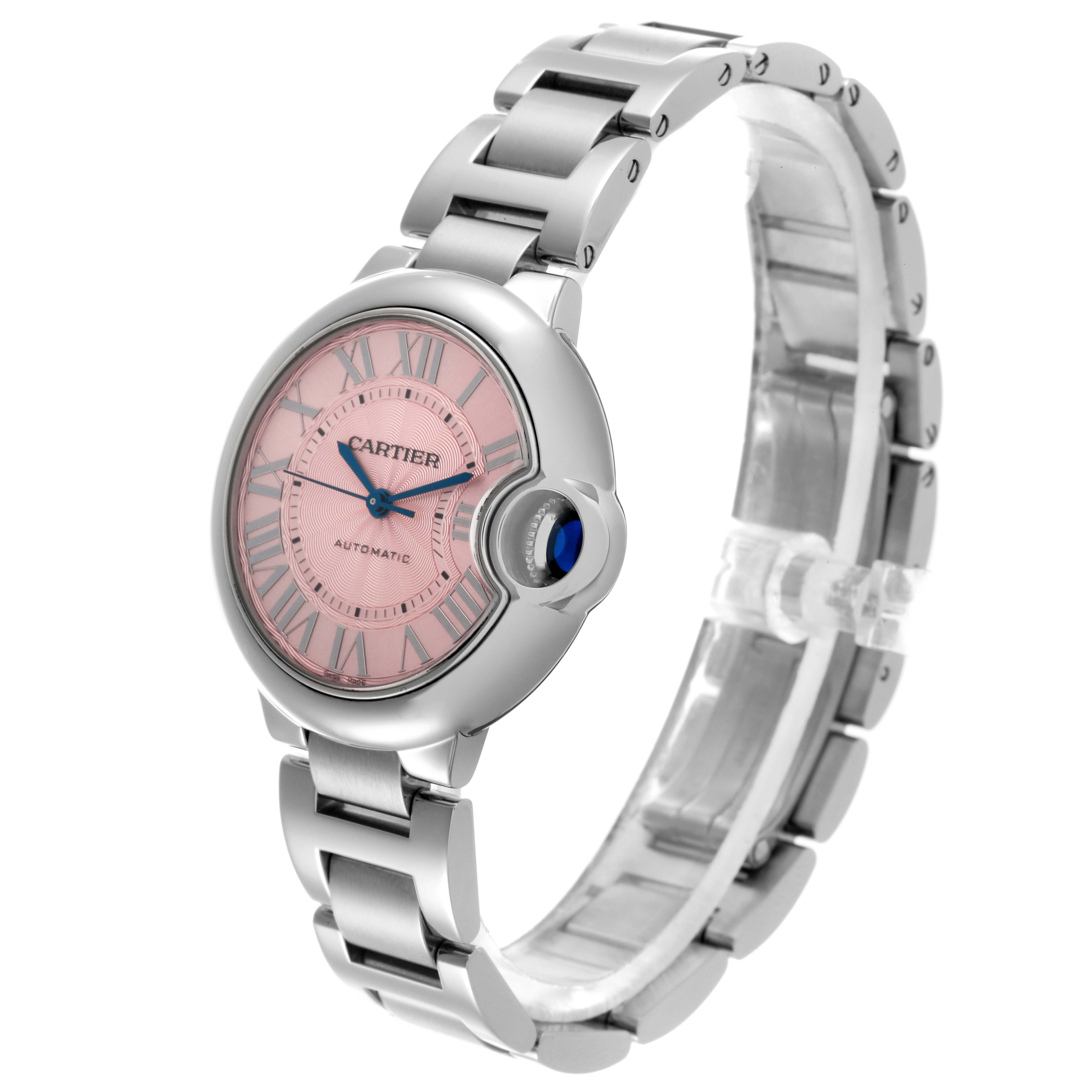 The Cartier Ballon Bleu W6920100 Women's Stainless Steel Pink Dial W6920100 Women's Stainless Steel Pink Dial watch is shown from a left-side angle, displaying the pink dial, blue Roman numerals, and silver bracelet.