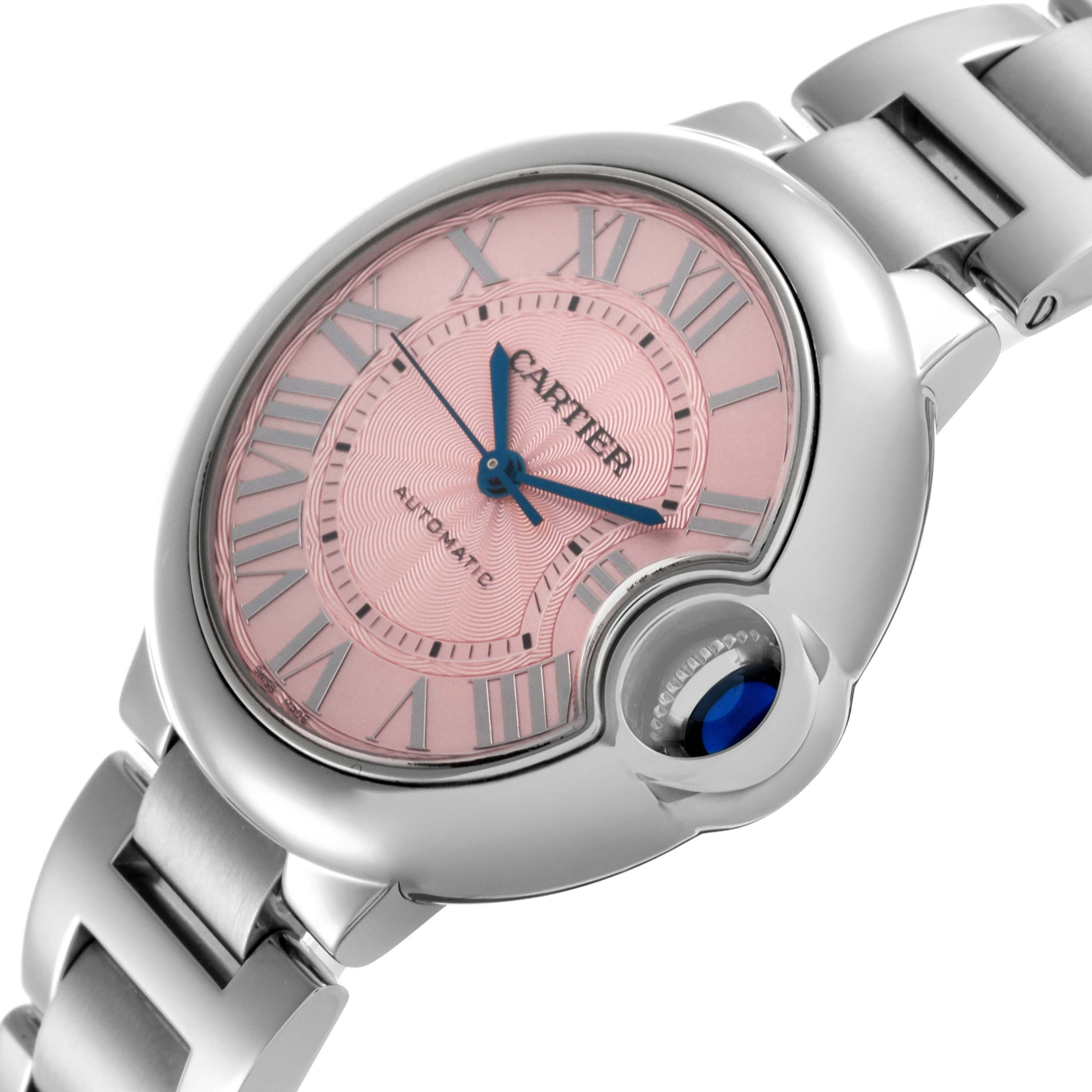 The Cartier Ballon Bleu W6920100 Women's Stainless Steel Pink Dial W6920100 Women's Stainless Steel Pink Dial watch is shown at an angled view, highlighting the pink dial, blue hands, and metallic bracelet.