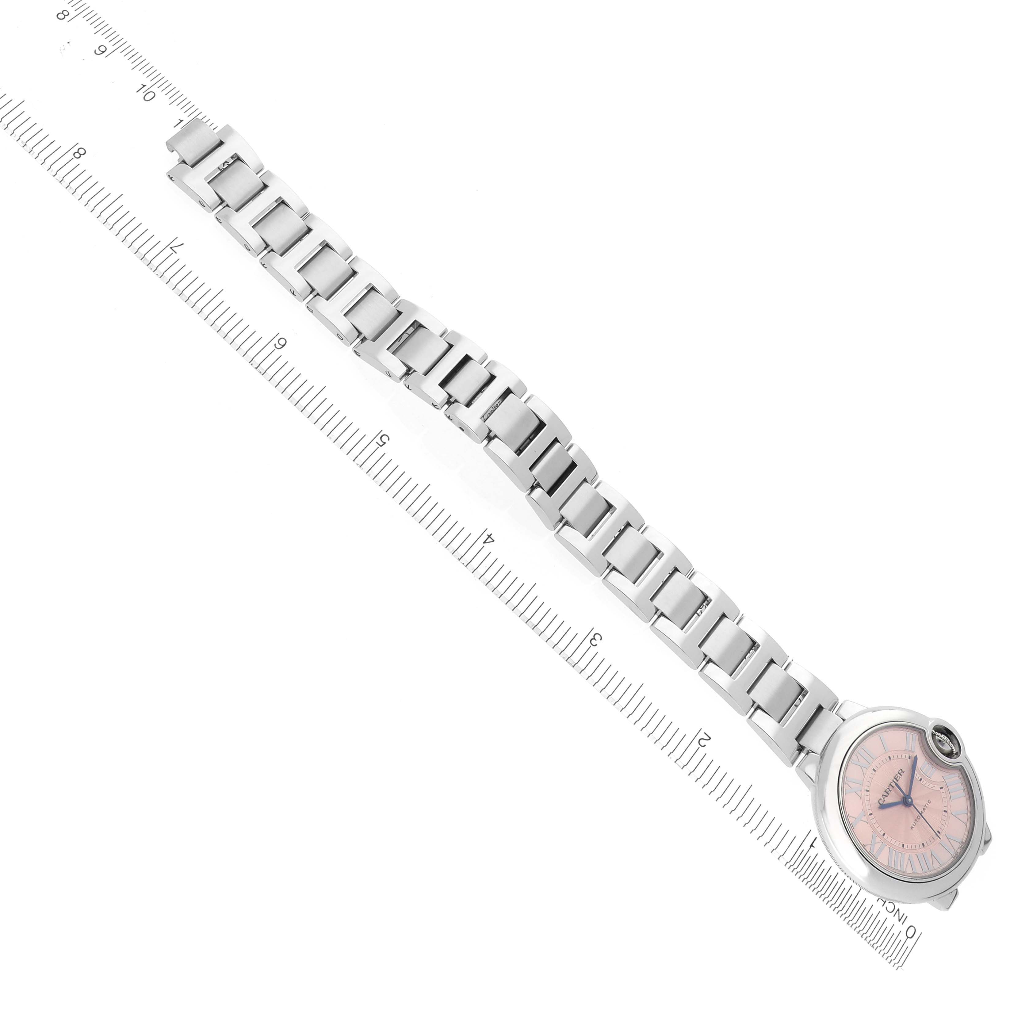 The Cartier Ballon Bleu W6920100 Women's Stainless Steel Pink Dial W6920100 Women's Stainless Steel Pink Dial watch is shown from a top-down angle, highlighting the full bracelet and pink dial.