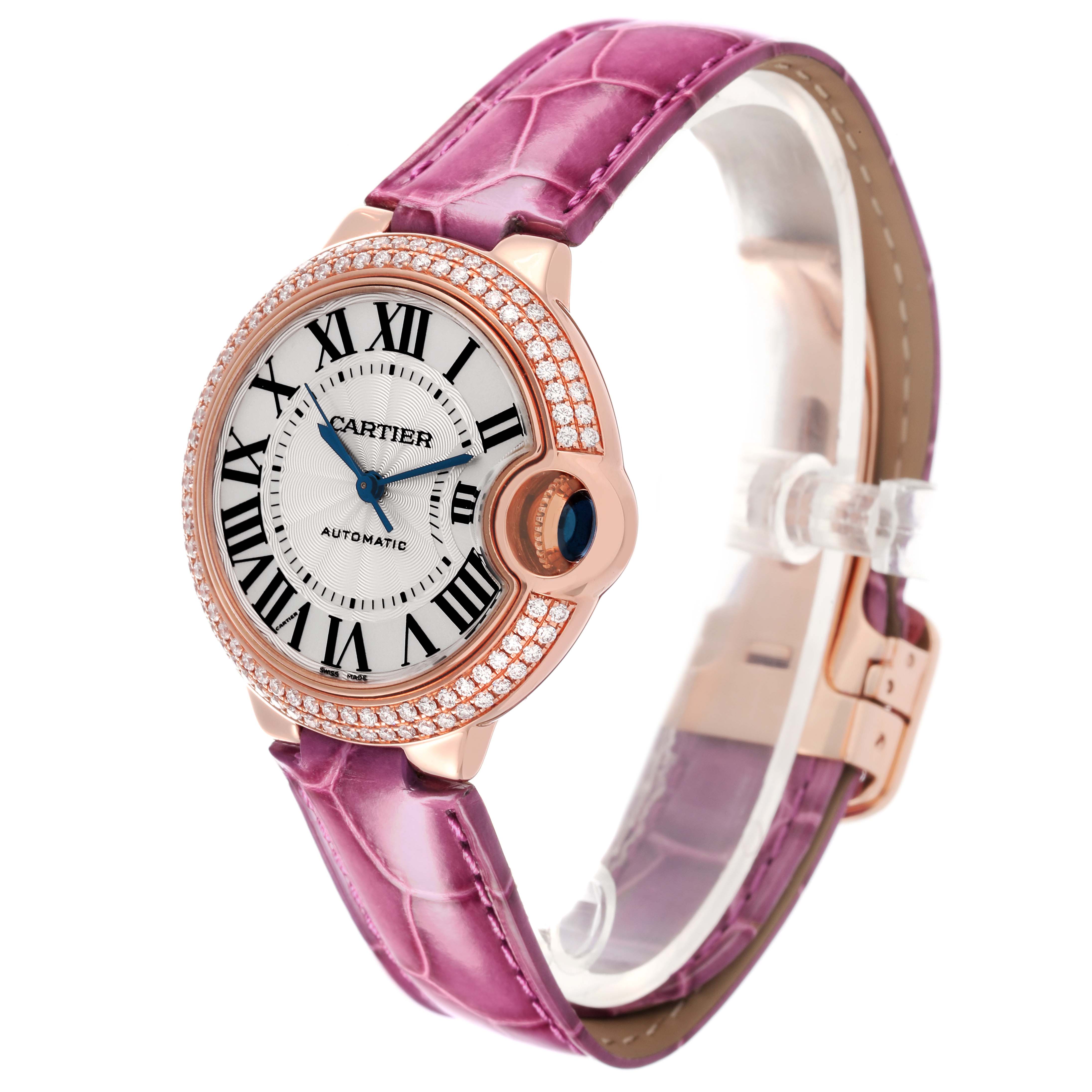 The Cartier Ballon Bleu WE902036 Women
s Rose Gold Silver Dial WE902036 Women
s Rose Gold Silver Dial watch is shown at a slight angle, highlighting the face, bezel, and pink strap.