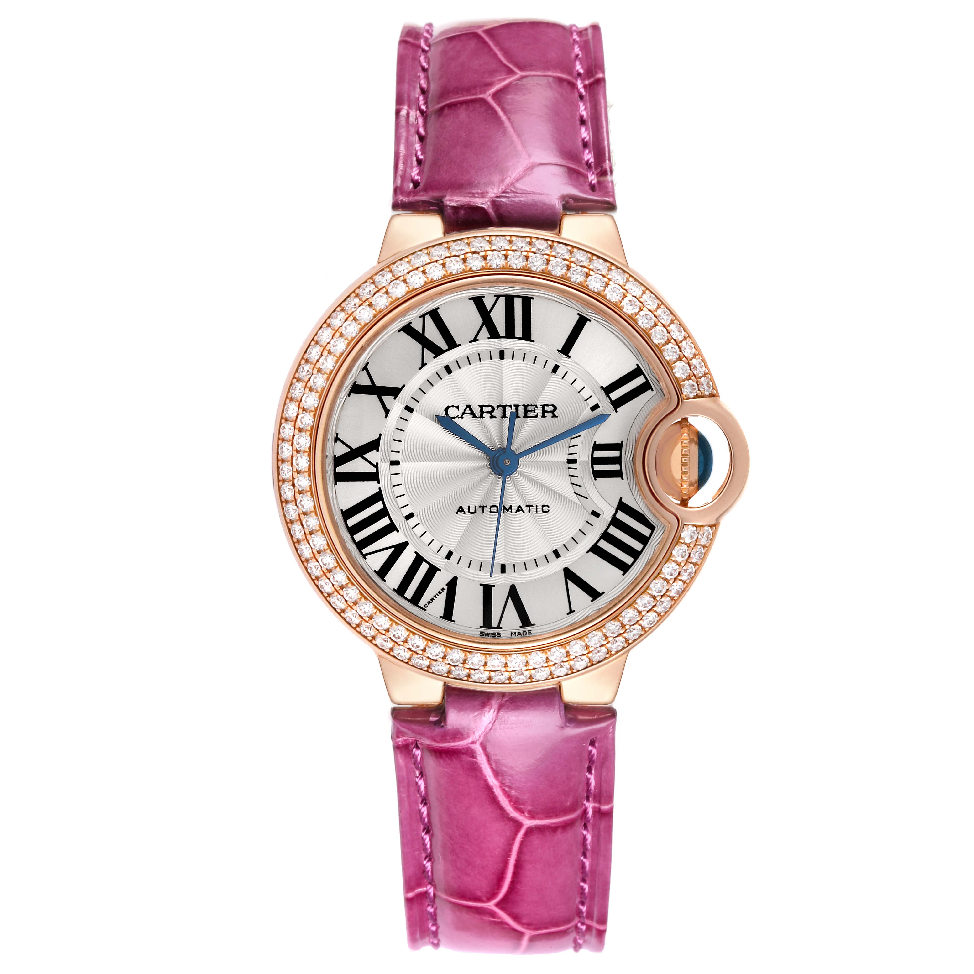 The Cartier Ballon Bleu WE902036 Women
s Rose Gold Silver Dial WE902036 Women
s Rose Gold Silver Dial watch is shown from a top view, highlighting its pink strap, diamond-set bezel, and Roman numeral dial.