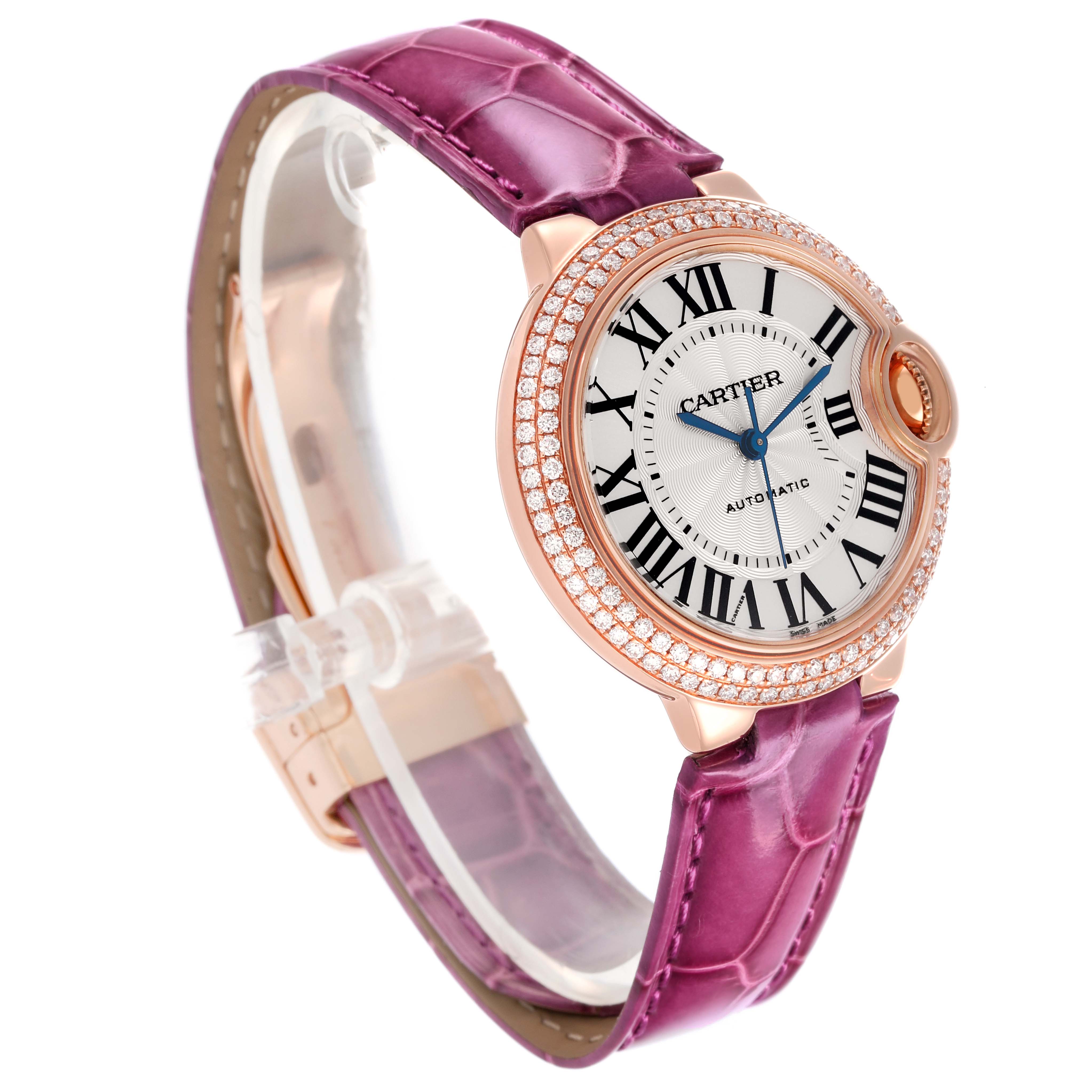 The Cartier Ballon Bleu WE902036 Women
s Rose Gold Silver Dial WE902036 Women
s Rose Gold Silver Dial watch is shown at a side angle, highlighting the dial, bezel, and pink leather strap.