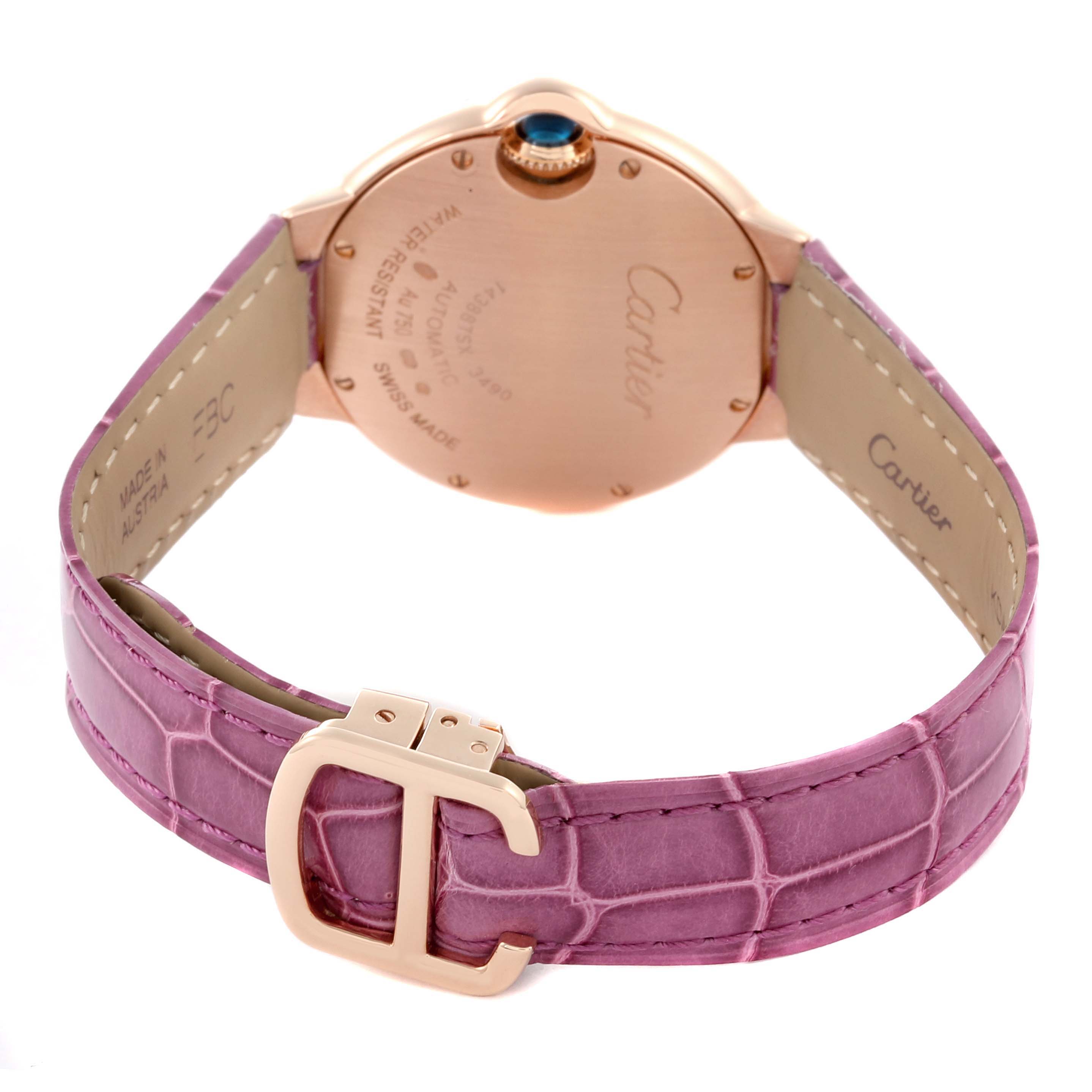 The image shows the back of the Cartier Ballon Bleu WE902036 Women
s Rose Gold Silver Dial WE902036 Women
s Rose Gold Silver Dial watch, displaying the case back, crown, and purple leather strap with a buckle.