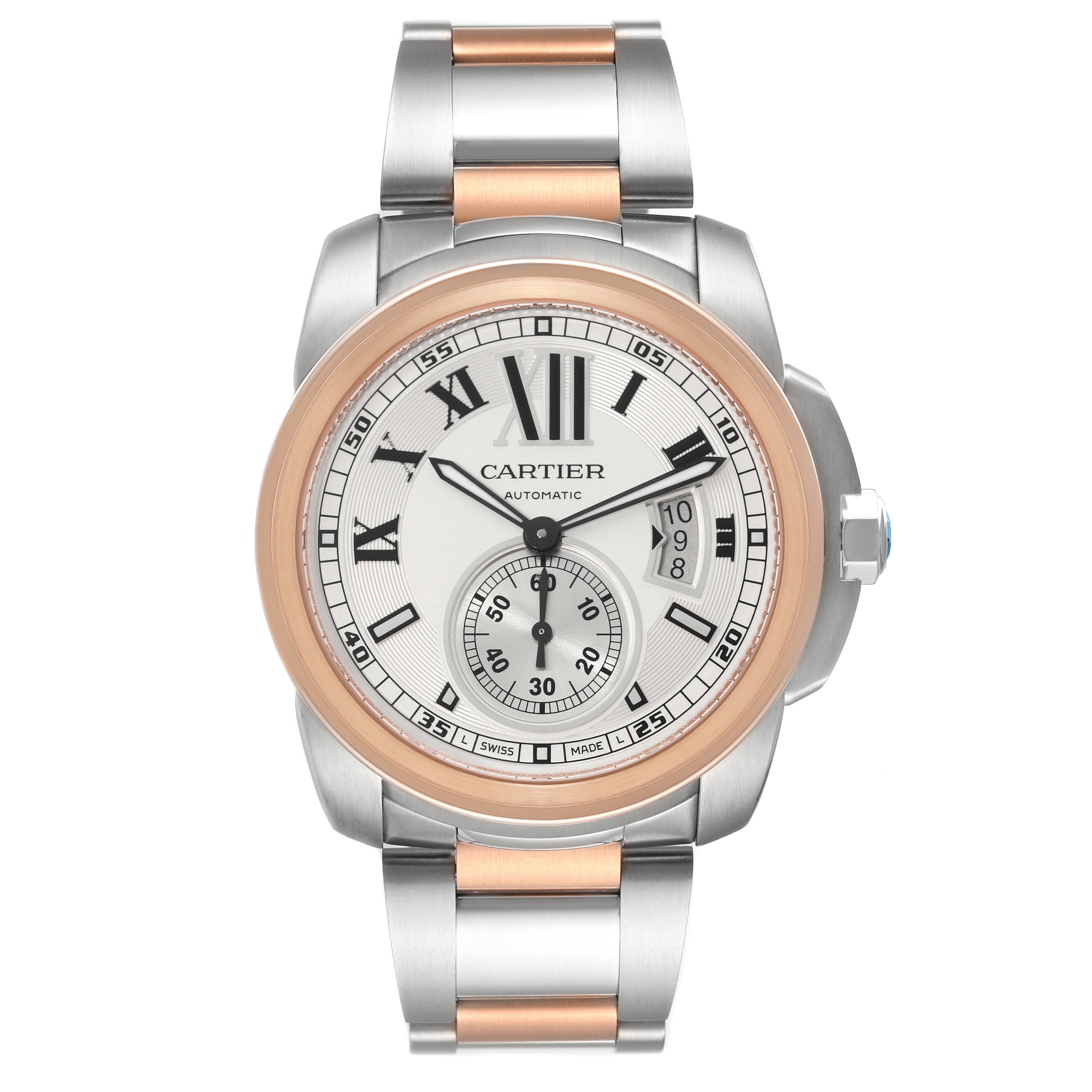 The image shows a frontal view of the Calibre de Cartier model watch by Cartier, featuring a silver and rose gold band.