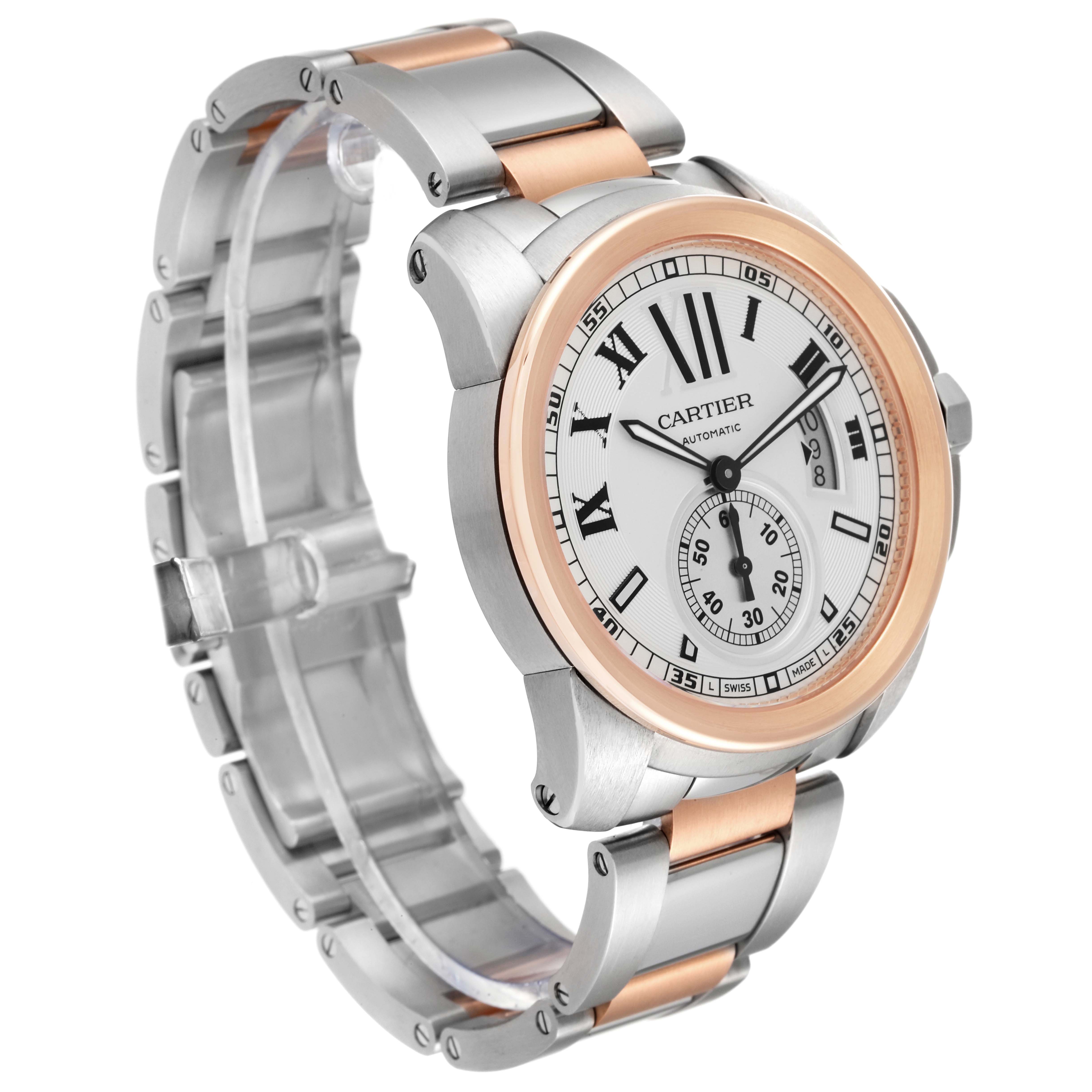 The image shows a Calibre de Cartier watch by Cartier from an angled view, highlighting the dial, bezel, and bracelet.