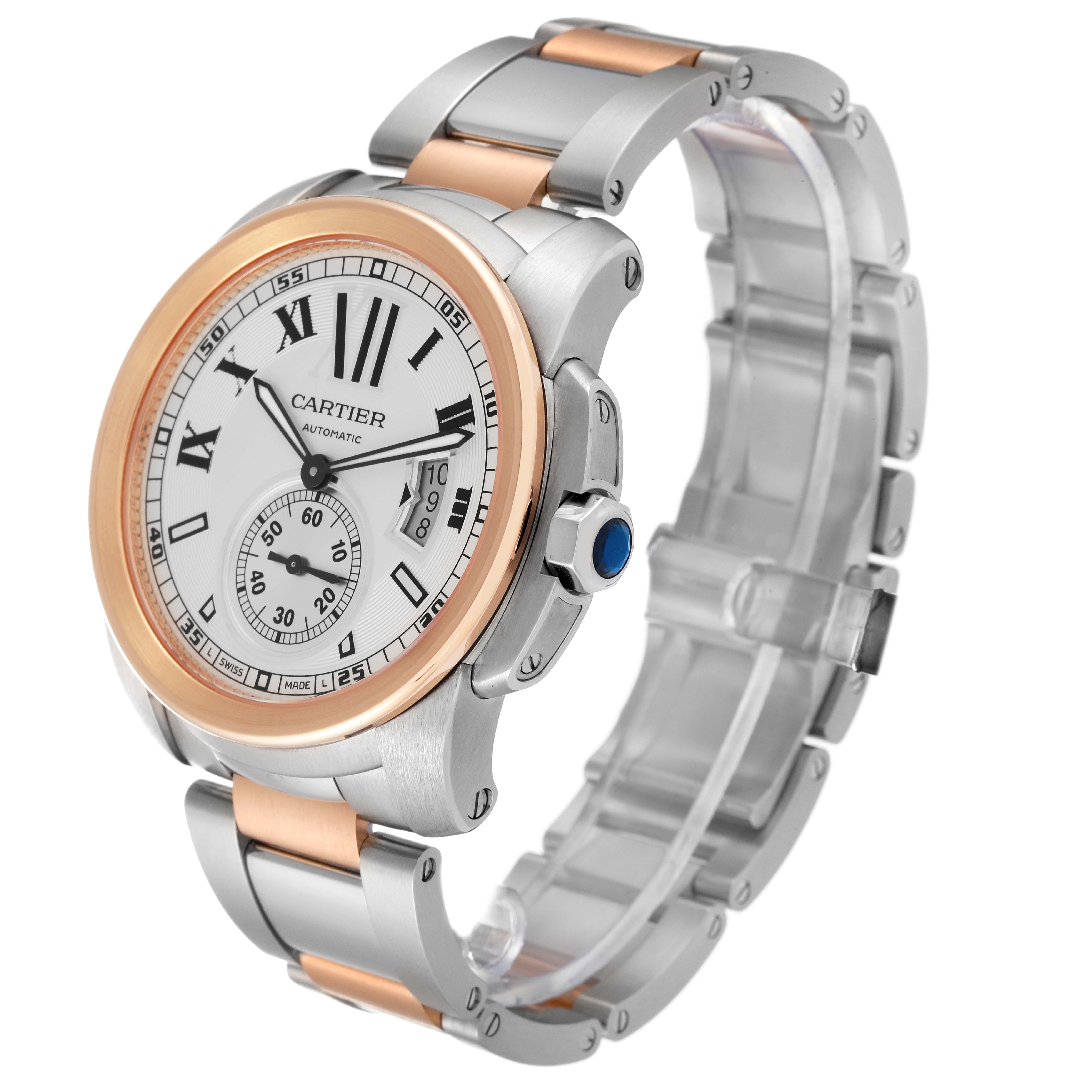 The image shows a Calibre de Cartier watch by Cartier at an oblique angle, highlighting the face, bezel, and band.