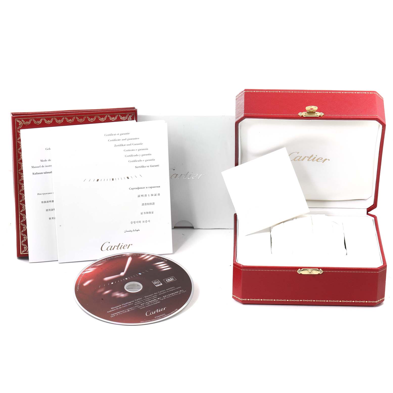 The image shows the packaging and accessories for a Calibre de Cartier watch by Cartier, including the box, manuals, and a CD.