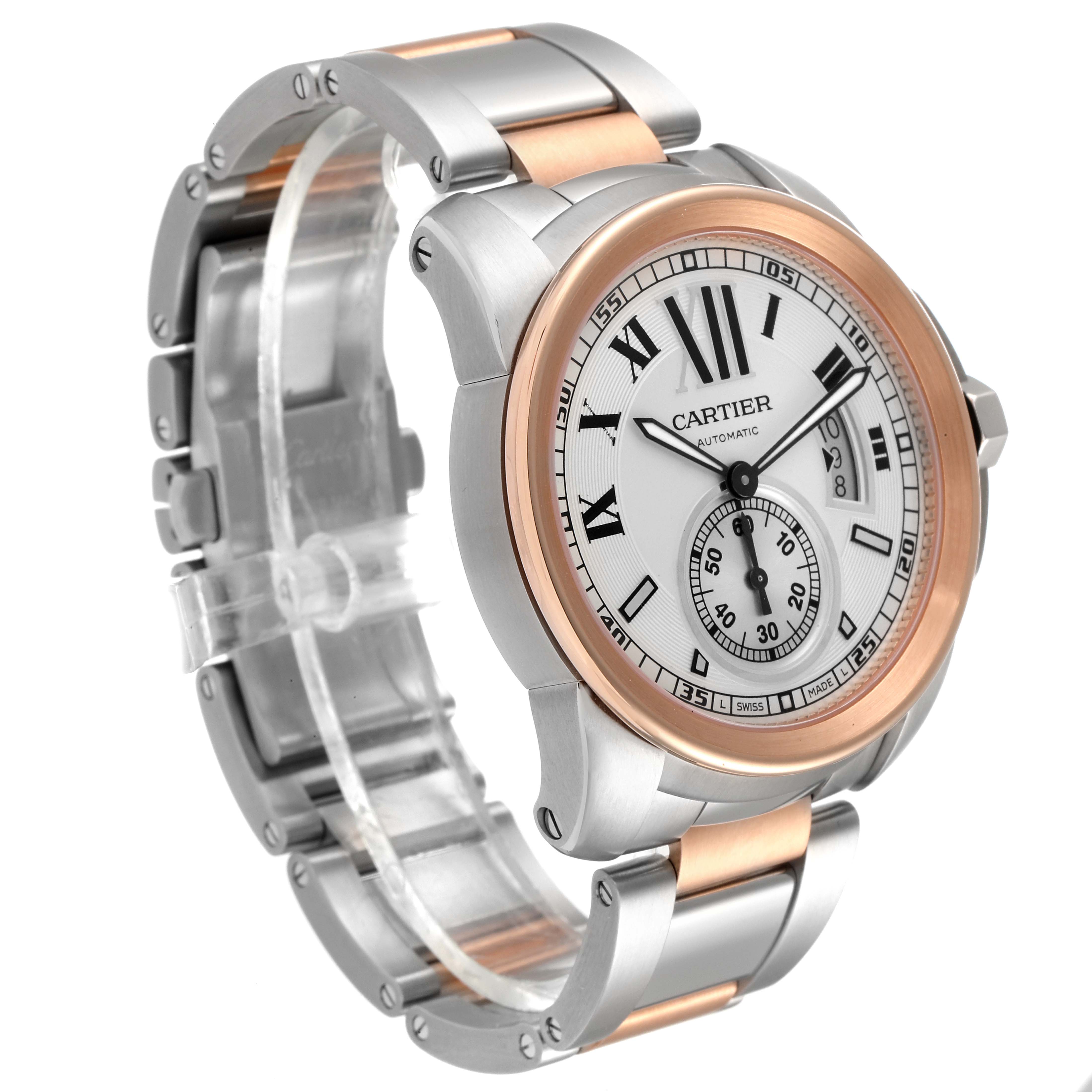 The image shows a Calibre de Cartier watch by Cartier at a front angle, highlighting the face, bezel, and band.