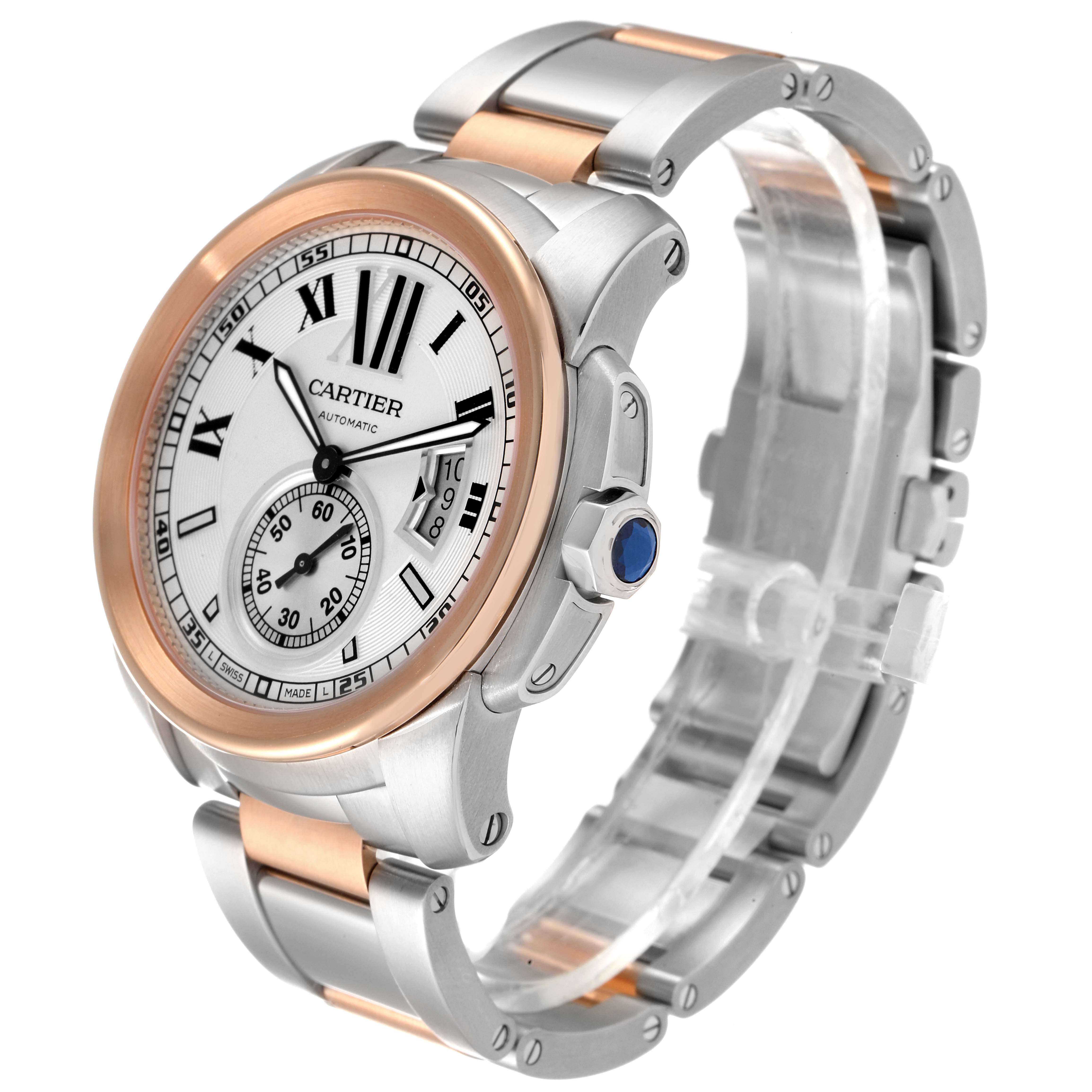 The image shows a Calibre de Cartier watch by Cartier at a three-quarter angle, highlighting its face, crown, and bracelet.