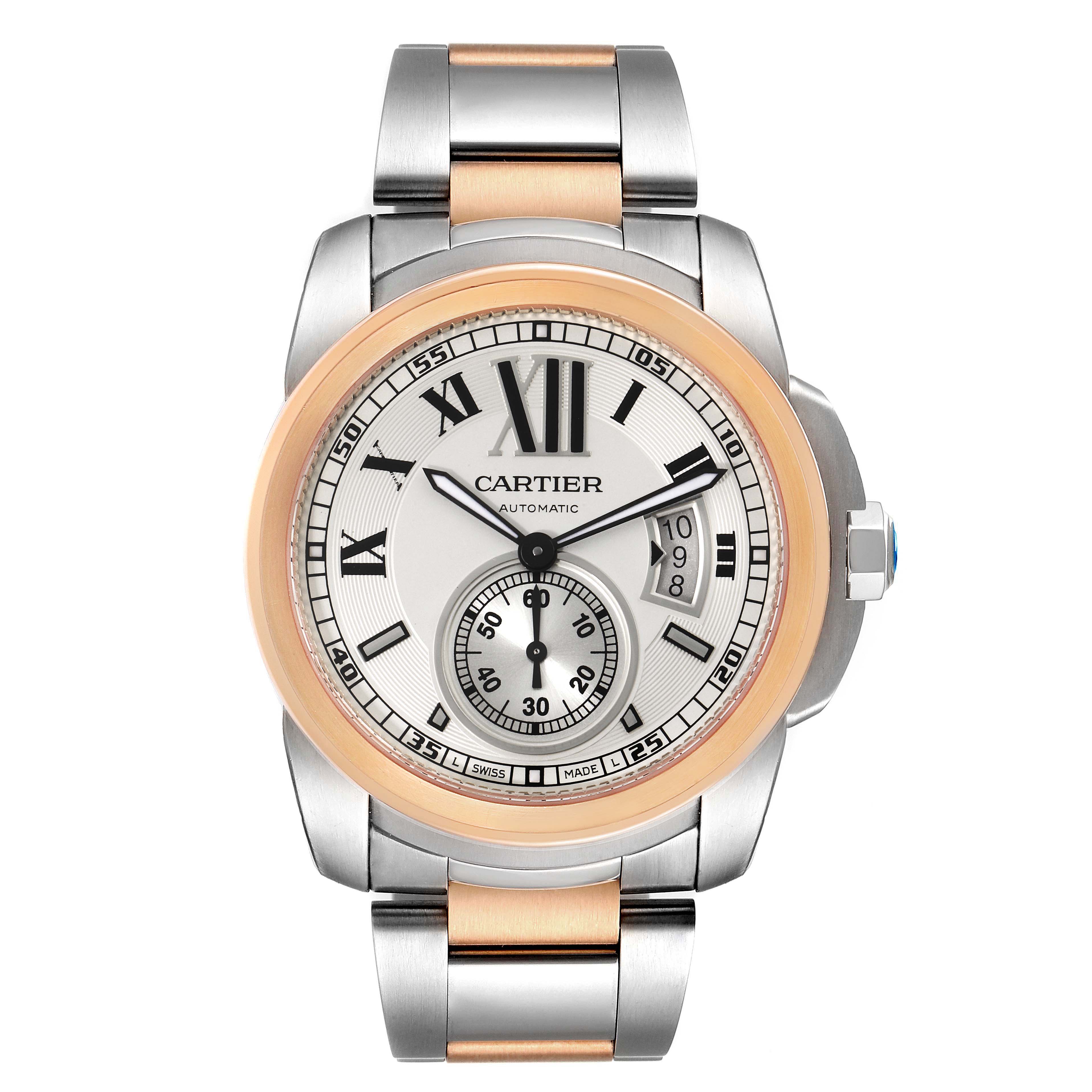 This image shows a front view of the Calibre de Cartier watch by Cartier, featuring its dial, hands, bezel, and bracelet.