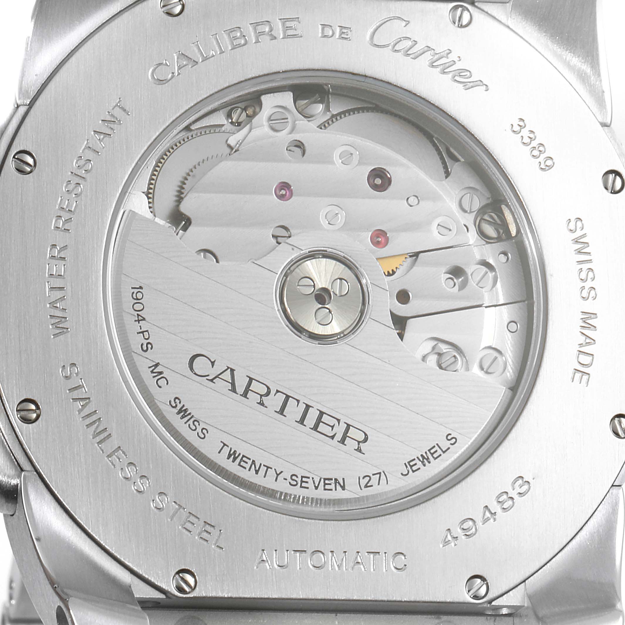 This image shows the back view of the Calibre de Cartier watch by Cartier, highlighting its automatic movement and inscriptions.