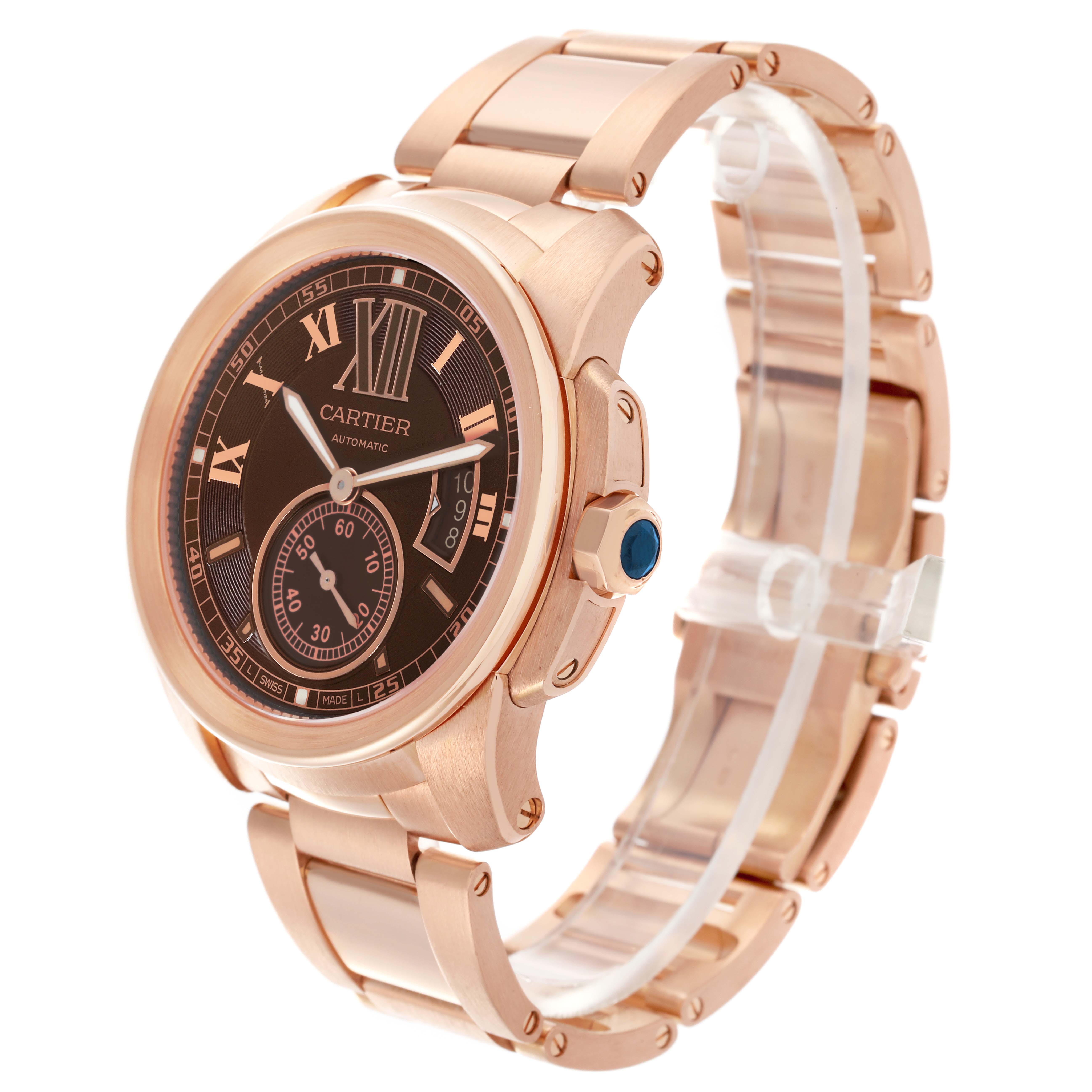 The Calibre de Cartier watch is shown at a three-quarter angle, highlighting the dial, bezel, and bracelet.