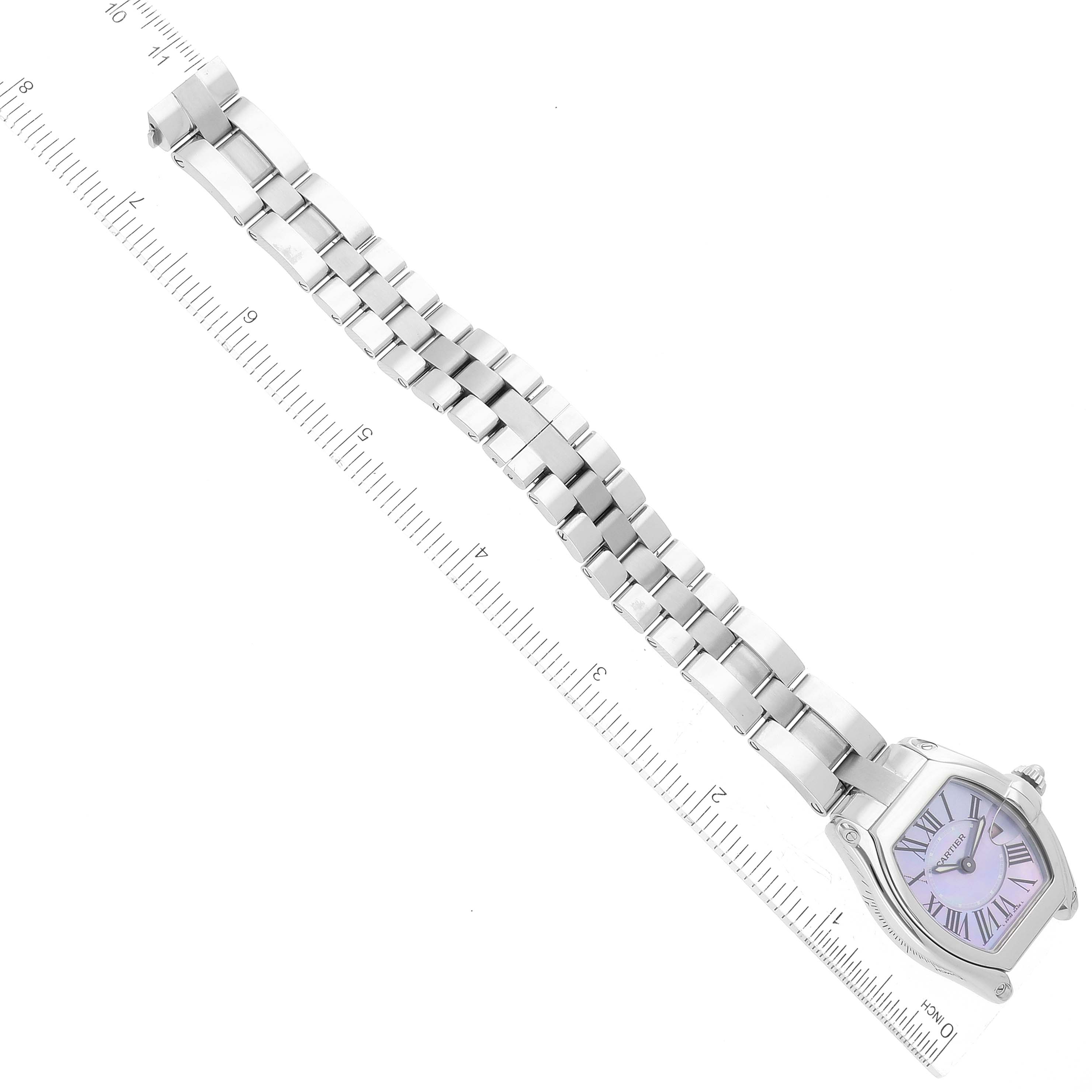 The image shows the entire Cartier Roadster W6206007 Women's Stainless Steel Mother of Pearl Dial W6206007 Women's Stainless Steel Mother of Pearl Dial watch with a silver bracelet, displayed at an angle with a measuring scale beside it.