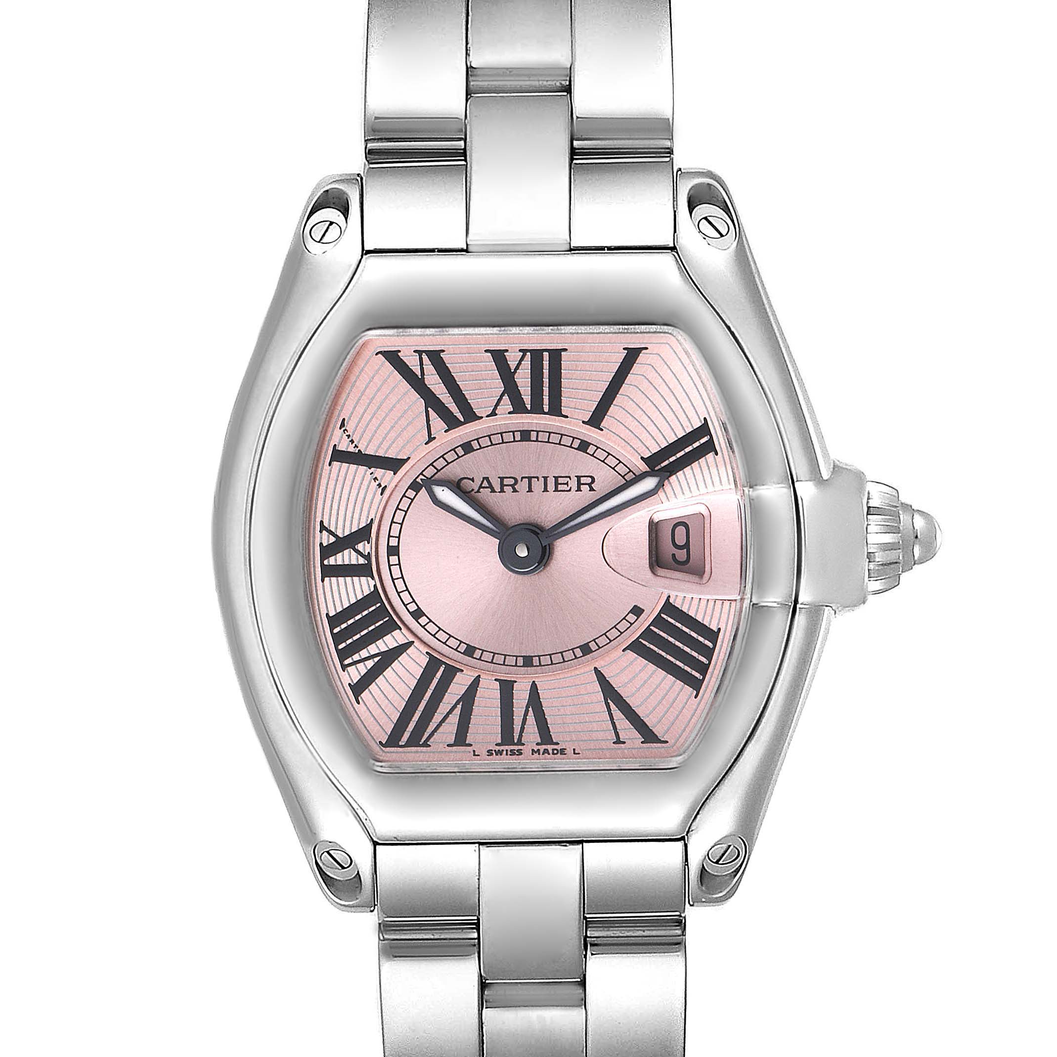 The image shows a frontal view of the Cartier Roadster W62017V3 Women's Stainless Steel Pink Dial W62017V3 Women's Stainless Steel Pink Dial watch, featuring its face, hands, date window, and part of the bracelet.