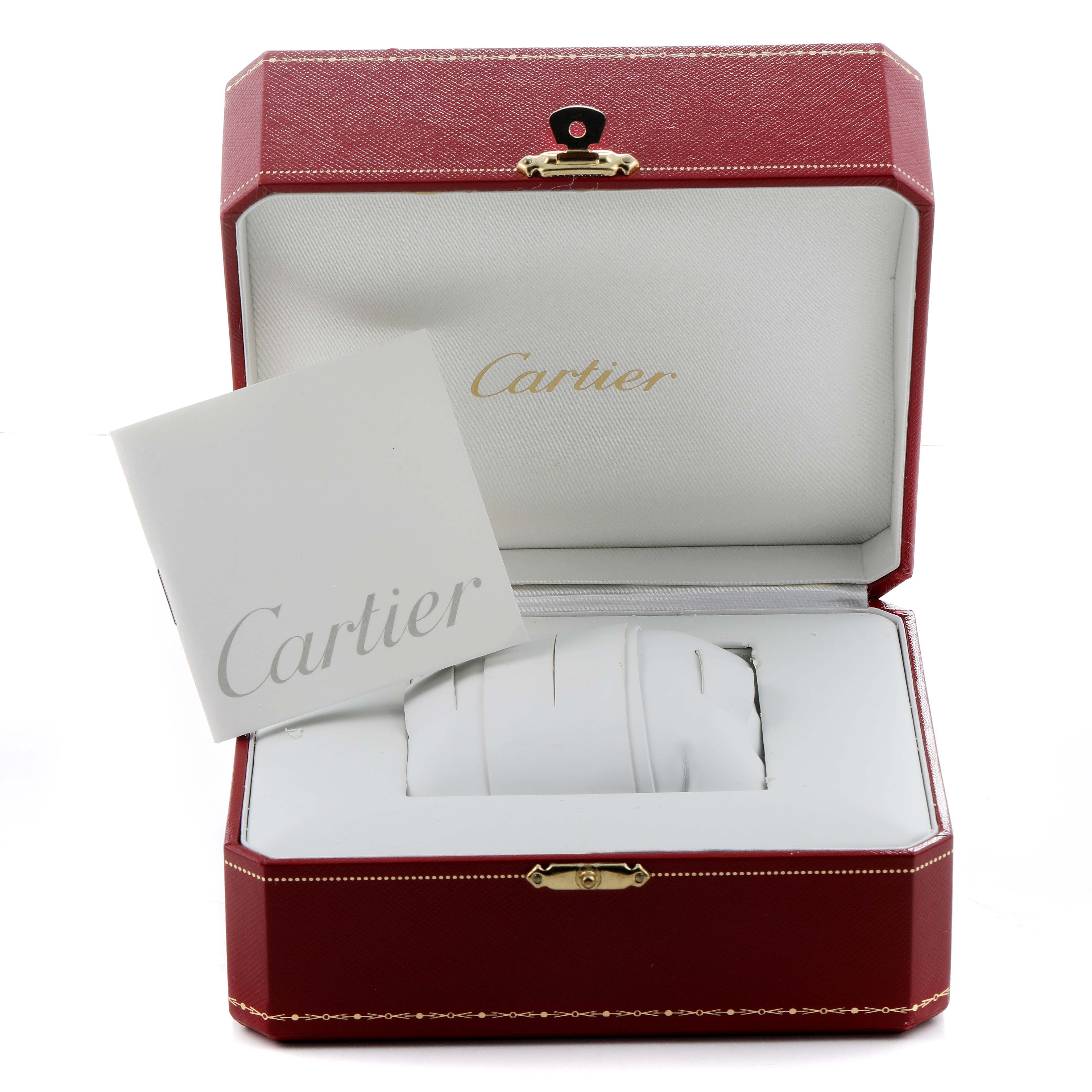 The image shows an open Cartier Santos Demoiselle W25066Z6 Women's Steel and Gold (two tone) Silver Dial watch box with a booklet, but the watch itself is not visible.