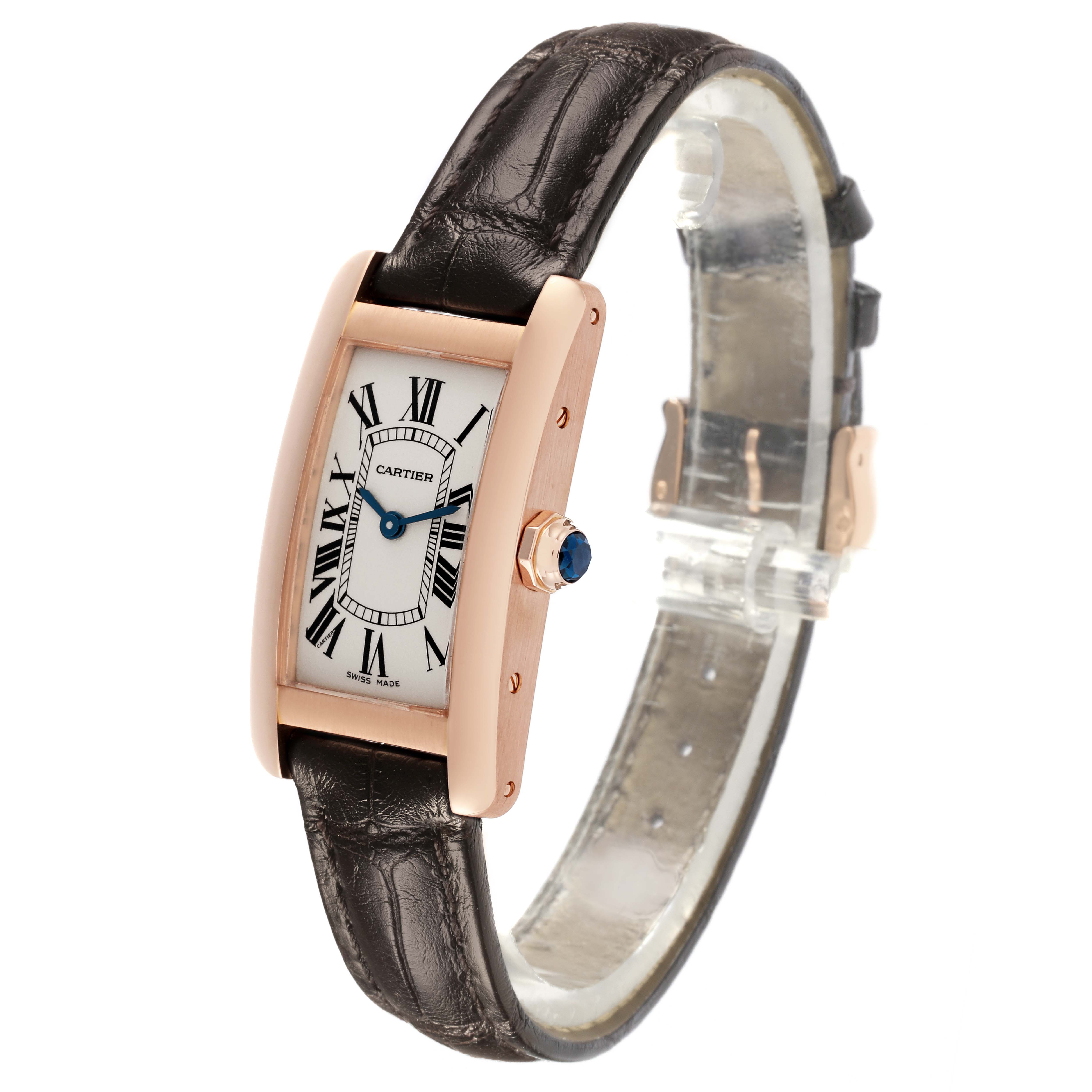 The Cartier Tank Americaine W2607456 Women's Rose Gold Silver Dial W2607456 Women's Rose Gold Silver Dial watch is shown at a three-quarter angle, highlighting its face, crown, and leather strap.
