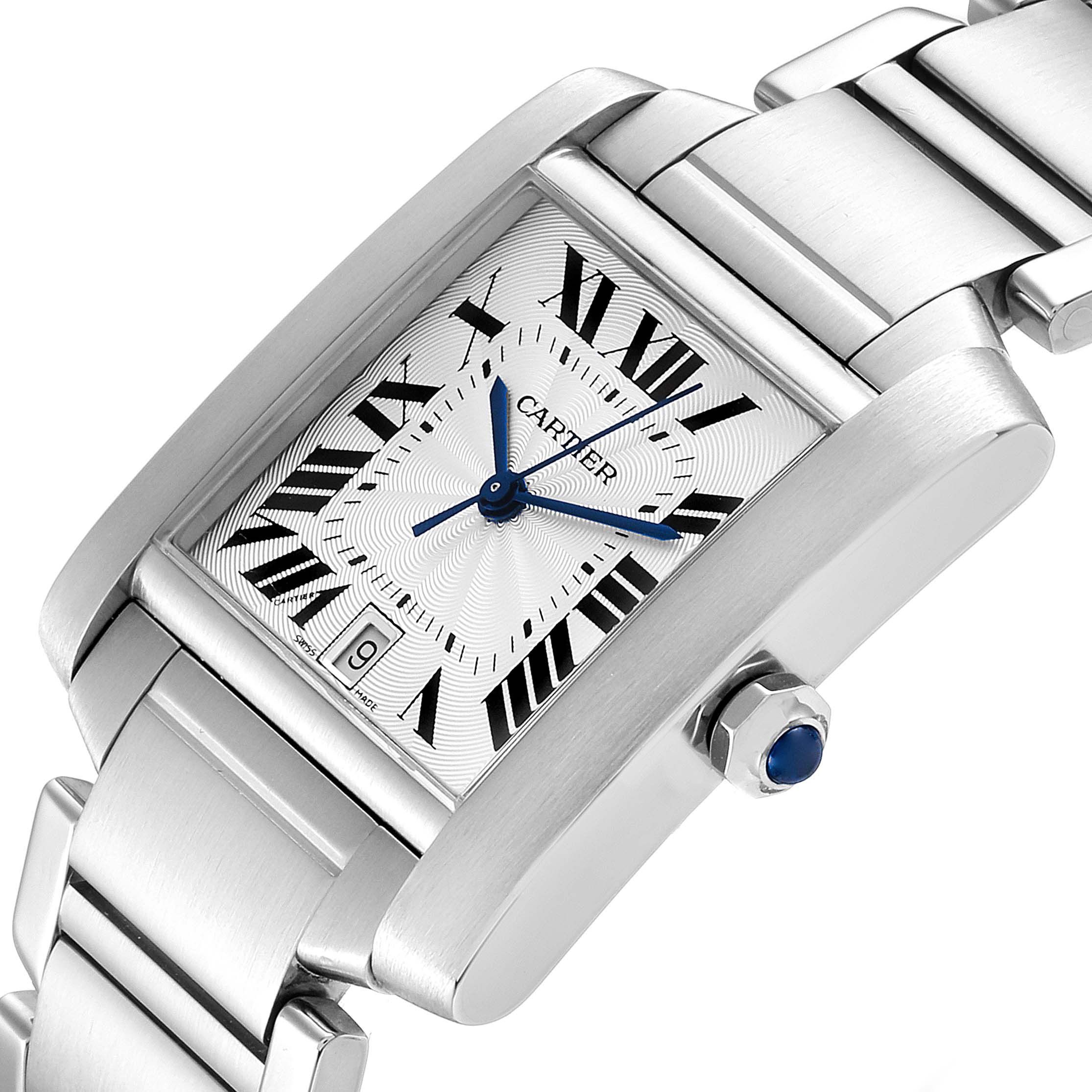 The image shows a close-up of the Cartier Tank Francaise W51002Q3 Men's Stainless Steel Silver Dial W51002Q3 Men's Stainless Steel Silver Dial watch, highlighting the dial, bracelet, and the crown with a blue cabochon.