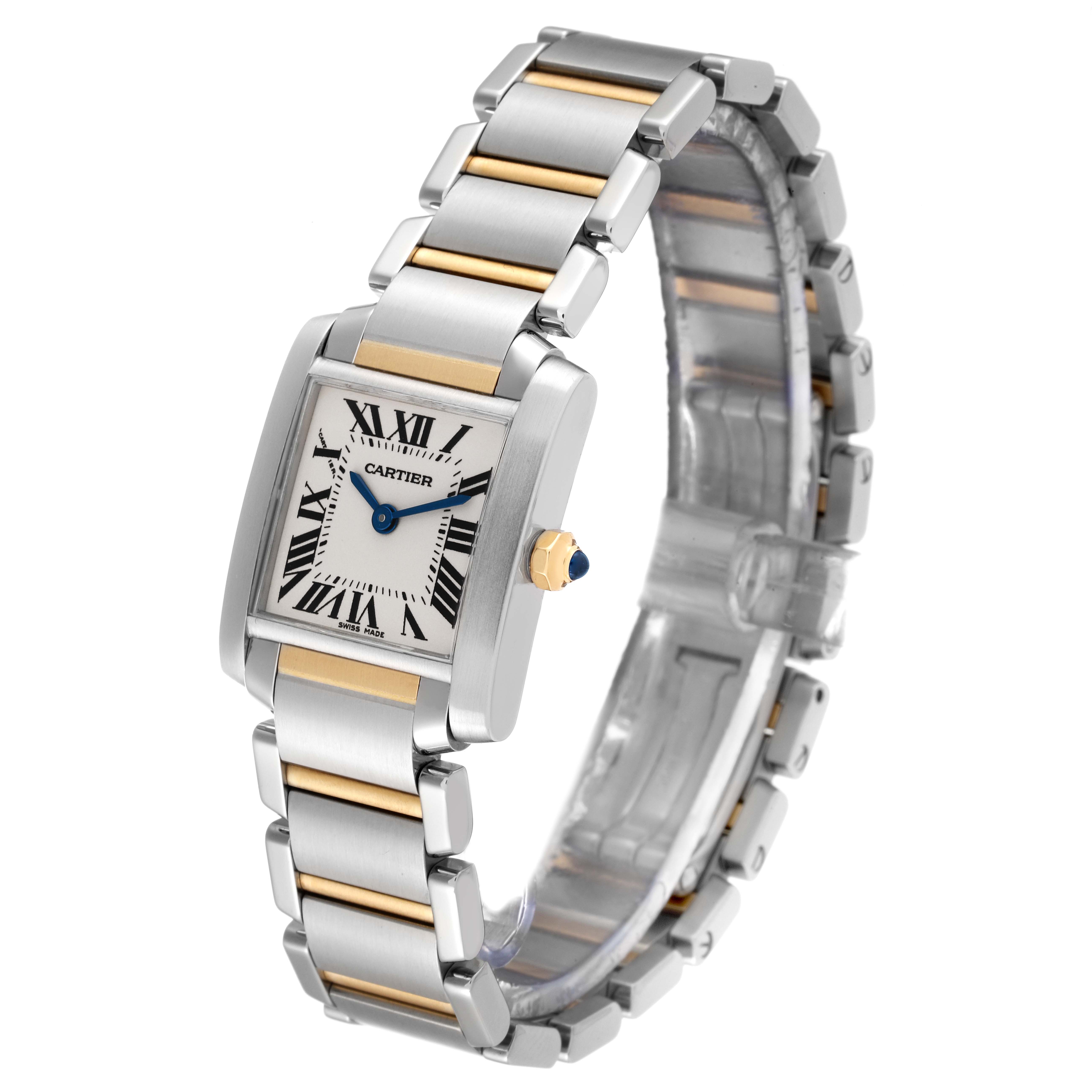 The image shows a Cartier Tank Française watch at a three-quarter angle, highlighting its rectangular face, silver and gold bracelet, and blue cabochon crown.