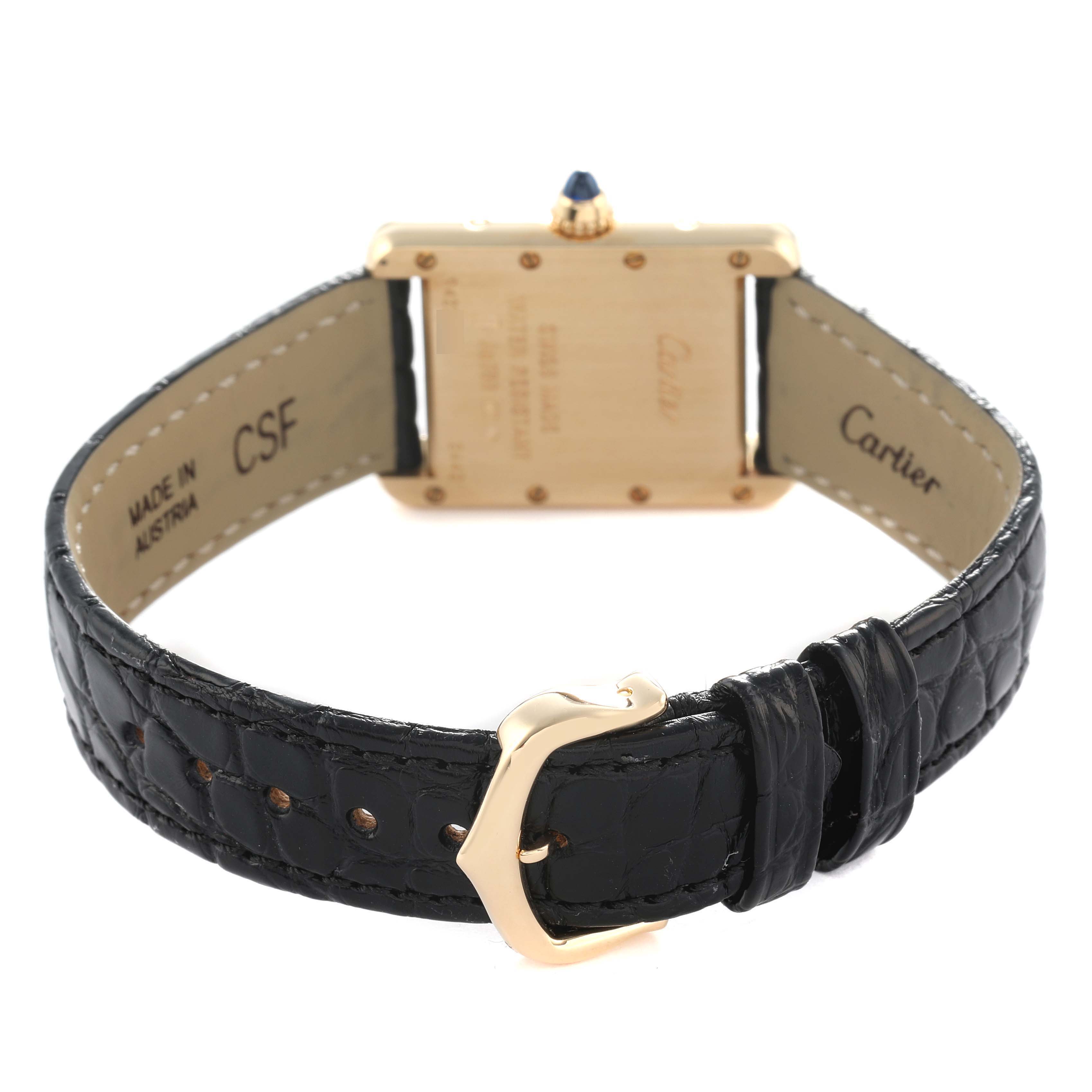 The Cartier Tank Louis W1529856 Women's Yellow Gold Silver Dial watch is shown from the back, featuring the case, strap, and gold buckle.