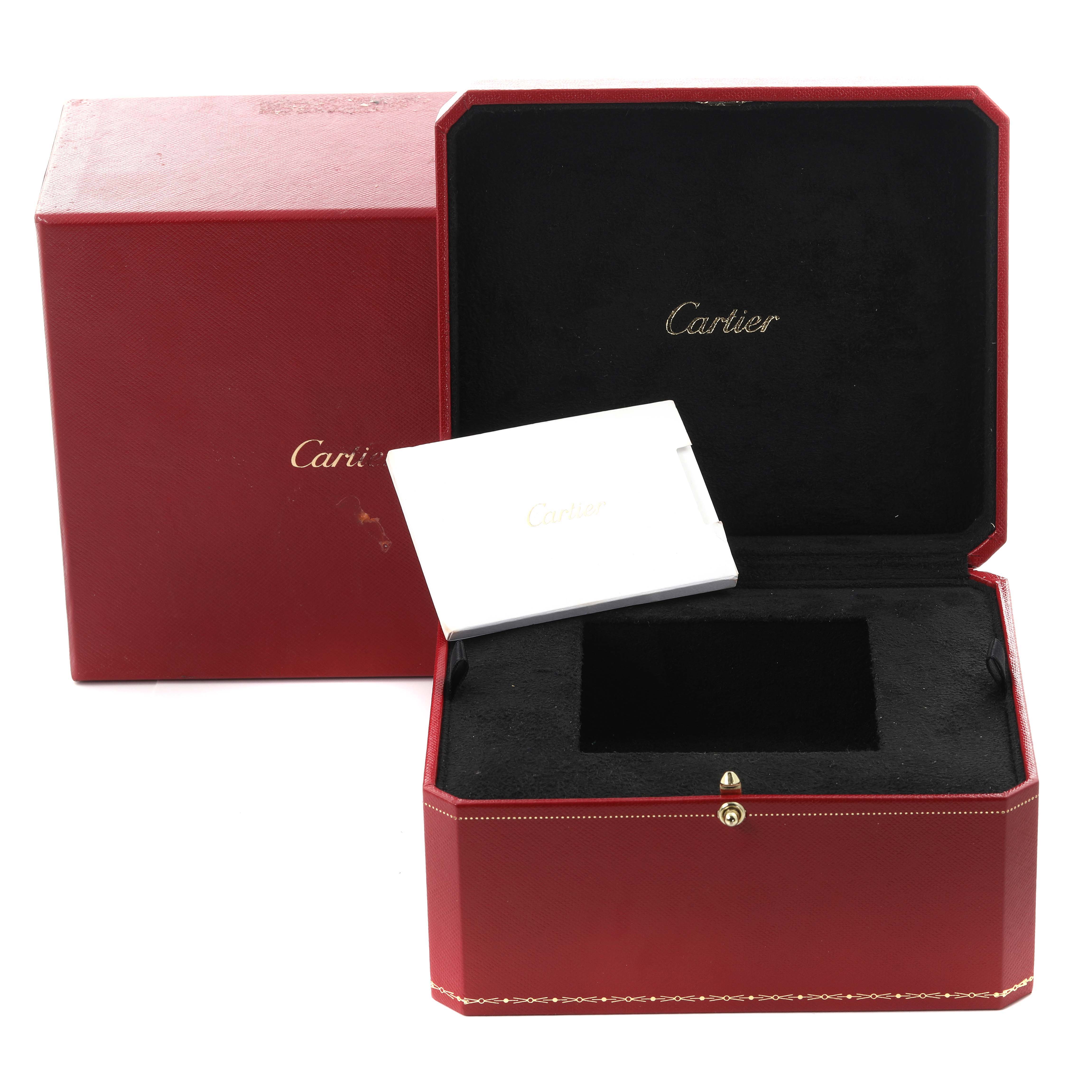 The image shows a Cartier Tank Must WSTA0051 Women's Stainless Steel Silver Dial WSTA0051 Women's Stainless Steel Silver Dial watch box, open at an angle with an inner cushion and booklet.