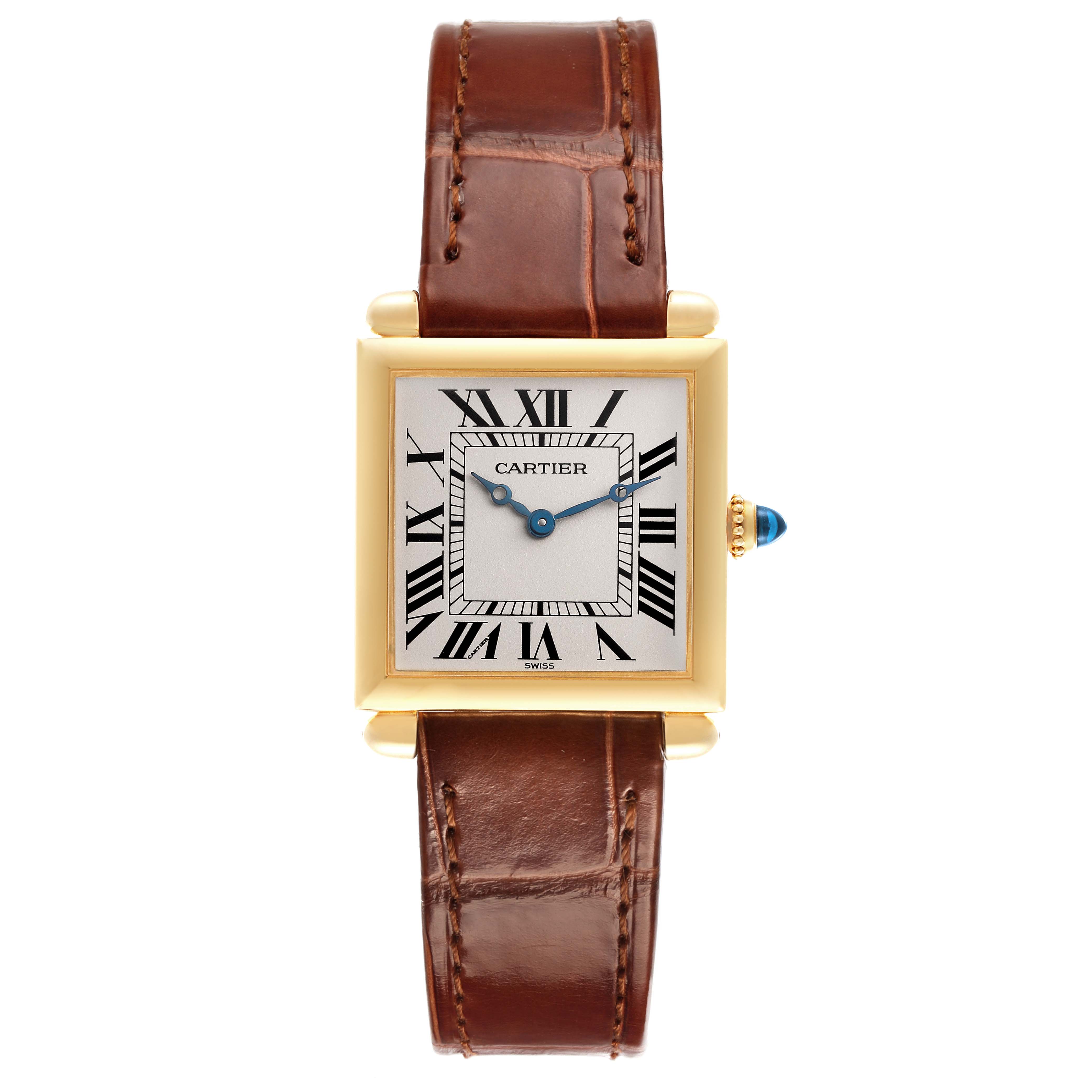 The Cartier Tank Obus W1512256 Women's Yellow Gold Silver Dial W1512256 Women's Yellow Gold Silver Dial watch is shown from a front angle, displaying its square face, Roman numerals, and brown leather strap.