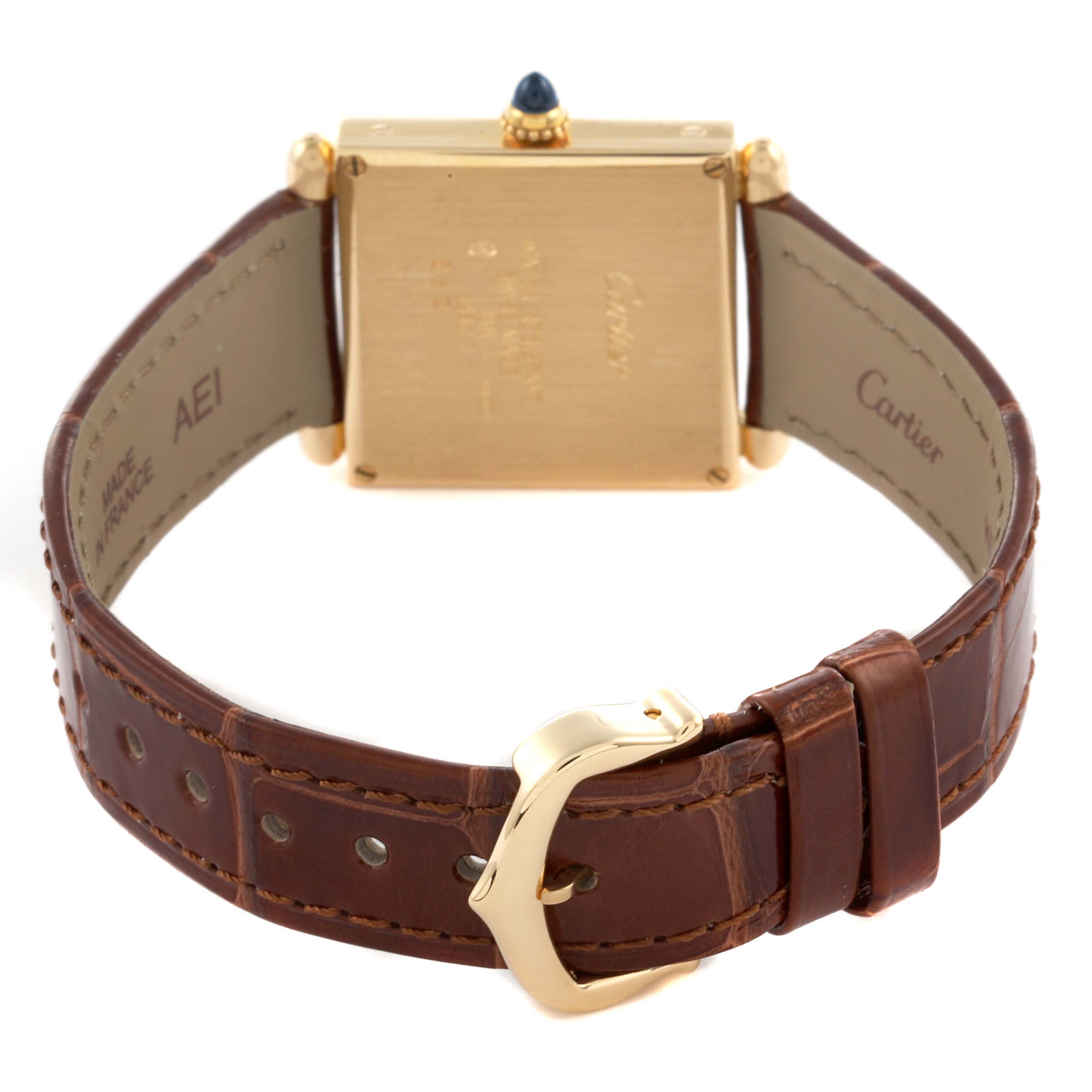 The image shows the back of the Cartier Tank Obus W1512256 Women's Yellow Gold Silver Dial W1512256 Women's Yellow Gold Silver Dial watch, highlighting the case, crown, and brown leather strap with a buckle.