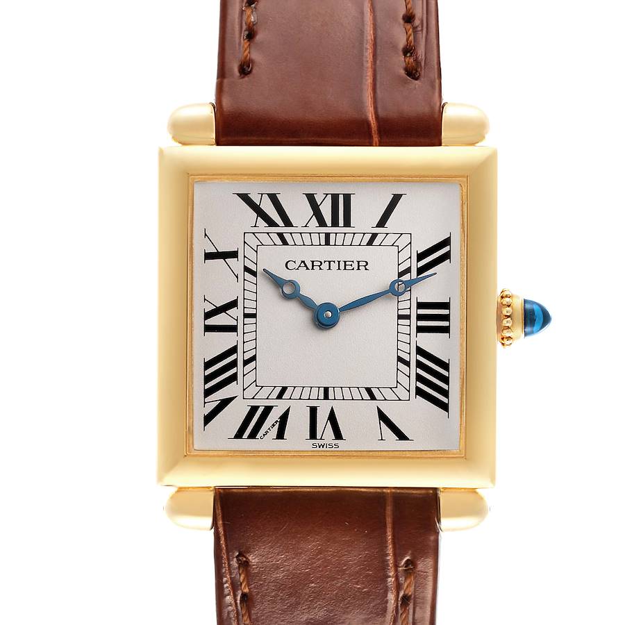 The Cartier Tank Obus watch is shown from the front, highlighting its face, bezel, crown, and leather strap.