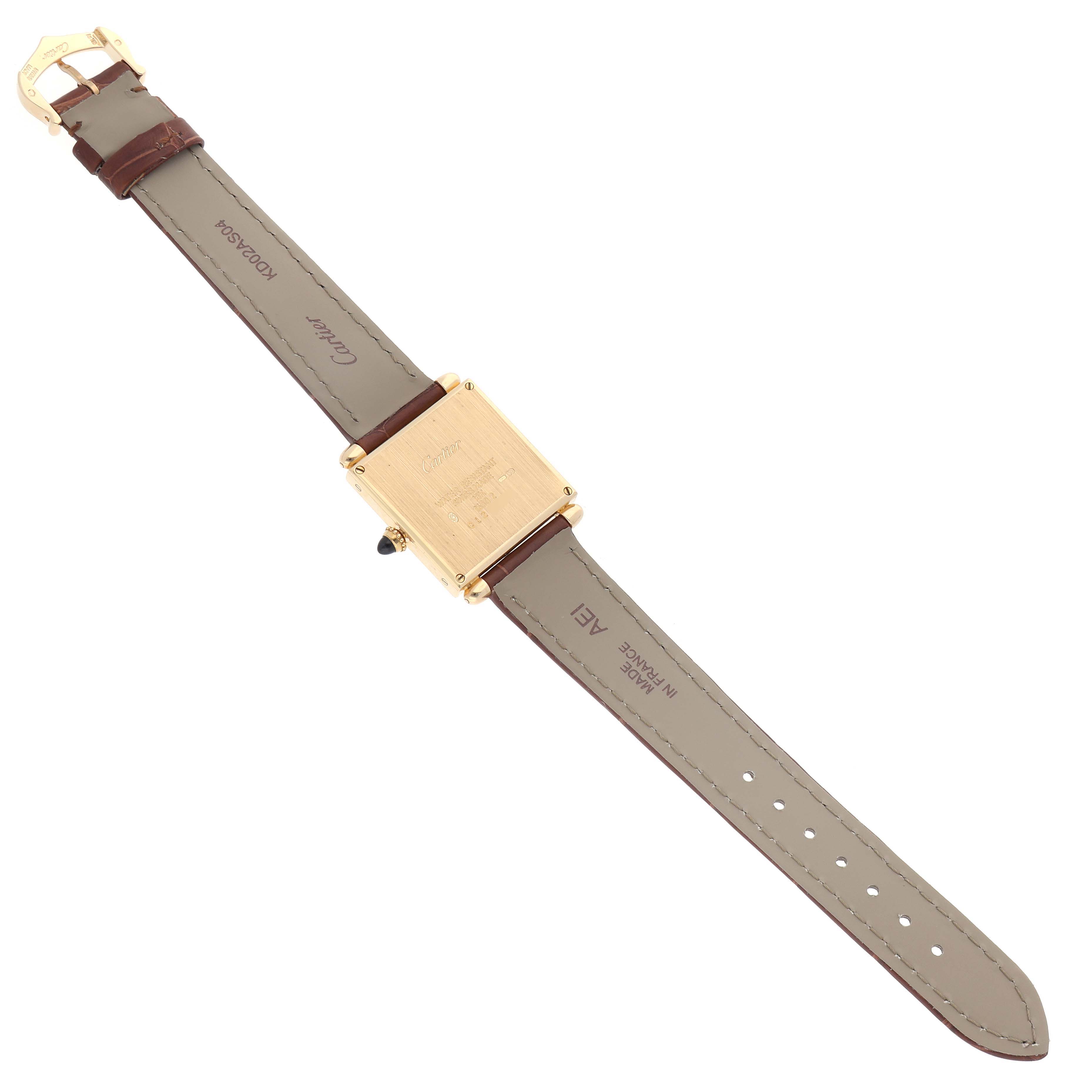 The image shows the back view of a Cartier Tank Obus W1512256 Women's Yellow Gold Silver Dial W1512256 Women's Yellow Gold Silver Dial watch, highlighting its strap and caseback details.