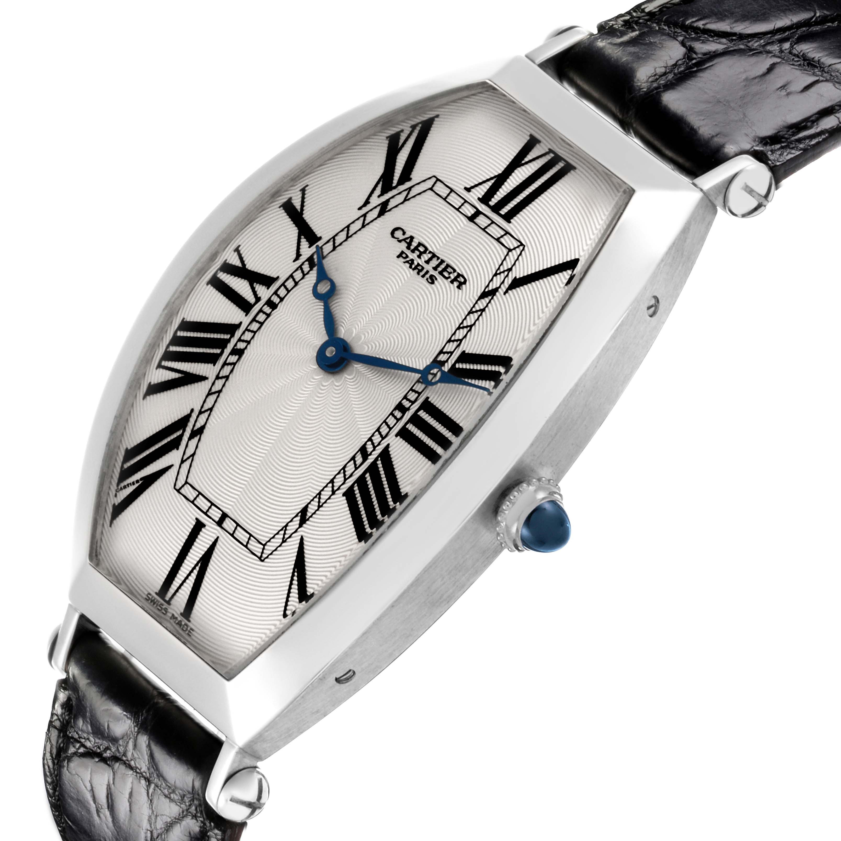 The Cartier Tonneau W1546351 Men's Platinum Silver Dial W1546351 Men's Platinum Silver Dial watch is shown at an angle, highlighting its face, crown, and leather strap.