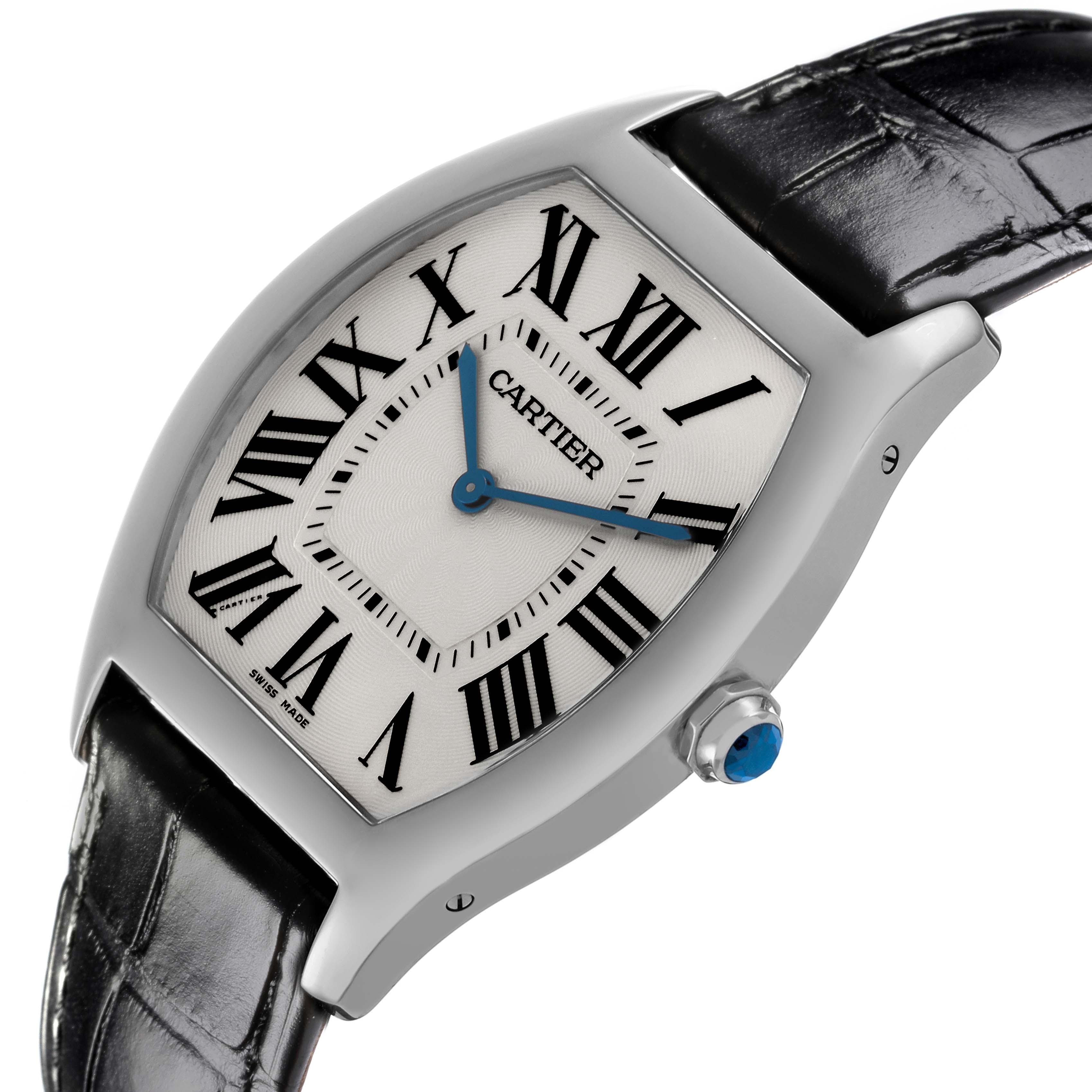 The Cartier Tortue WGTO0003 Men's White Gold Silver Dial WGTO0003 Men's White Gold Silver Dial watch is shown at an angle, displaying the face, Roman numerals, blue hands, crown, and black leather strap.