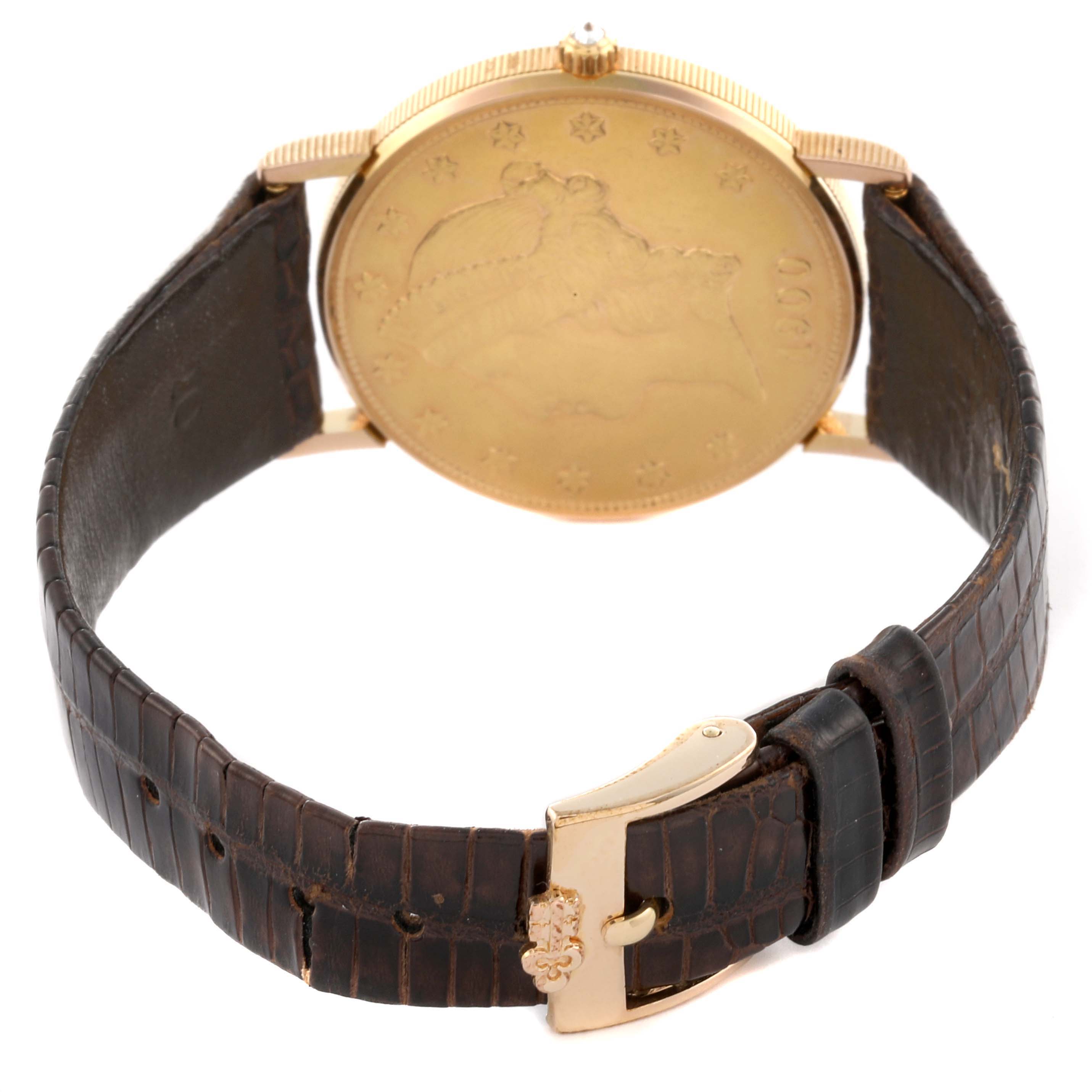 The Corum Coin Watch 1900 Men's Yellow Gold Champagne Dial 1900 Men's Yellow Gold Champagne Dial model is shown from the back, highlighting the gold case and leather strap.