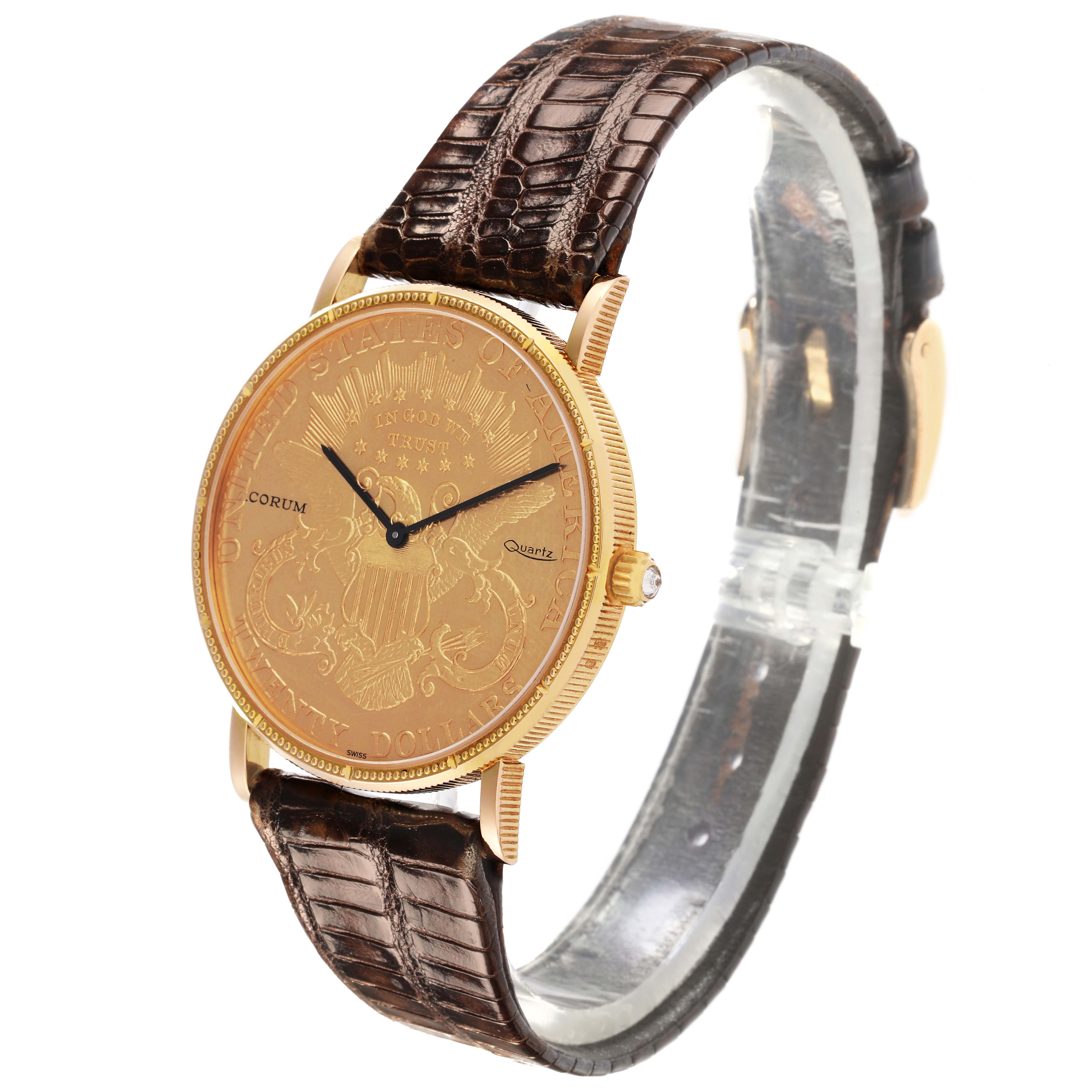 The Corum Coin Watch 1900 Men's Yellow Gold Champagne Dial 1900 Men's Yellow Gold Champagne Dial is shown at a slight angle, highlighting the gold face, black hands, crown, and brown leather strap.