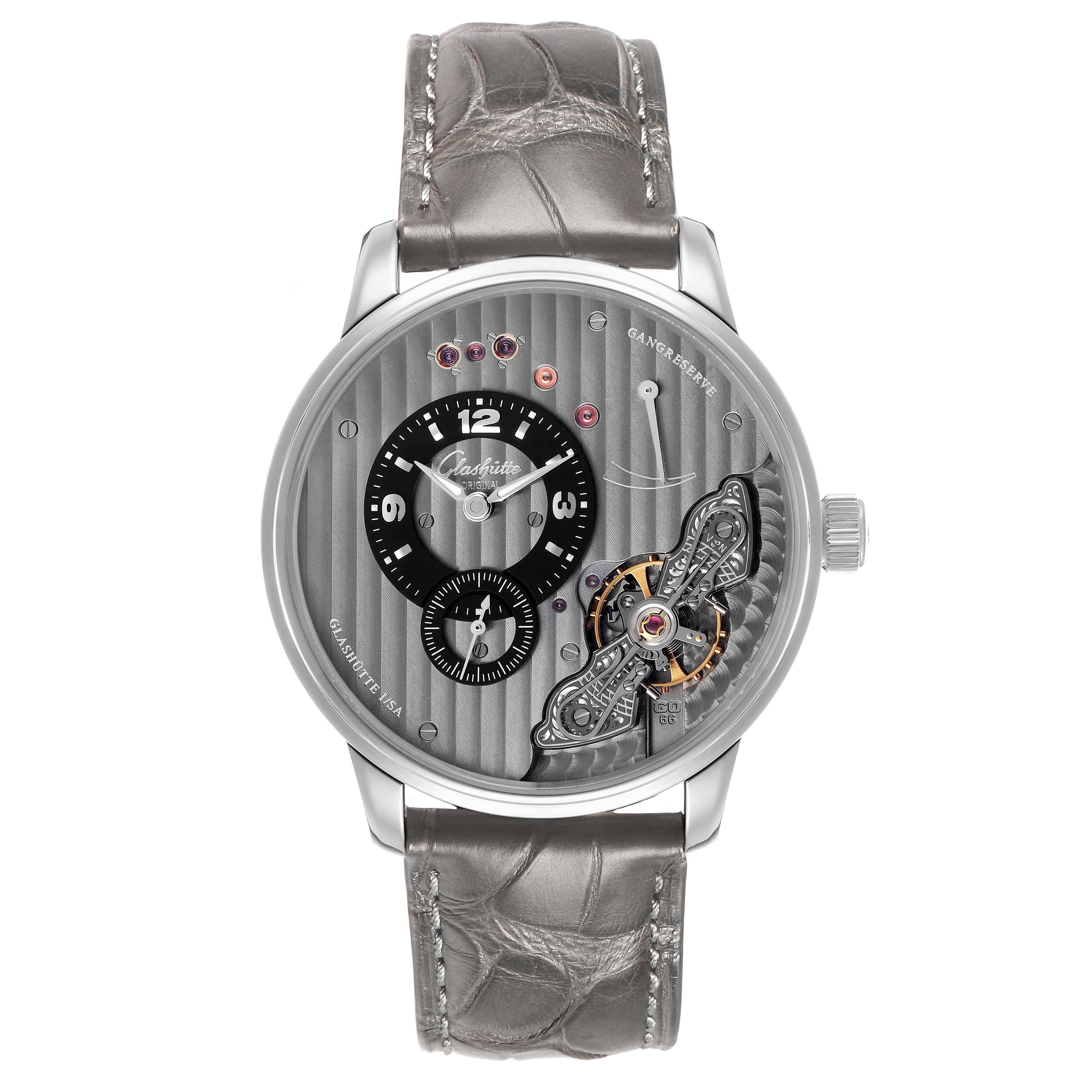 The Glashütte Original watch is shown from a front angle, highlighting the dial details and leather strap.