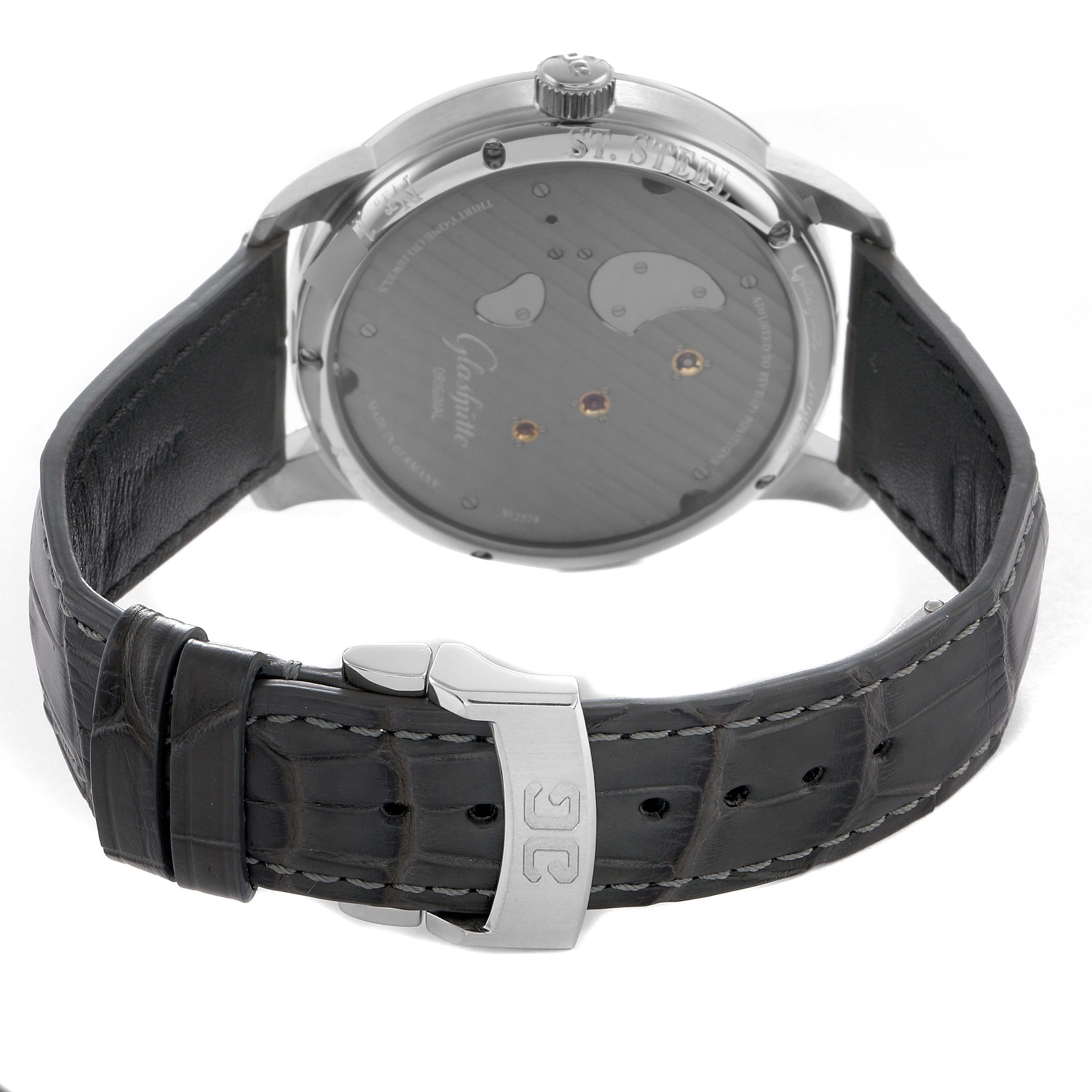 The image shows the back of a Glashütte Original watch, highlighting the leather strap, deployment clasp, and caseback with visible mechanisms.