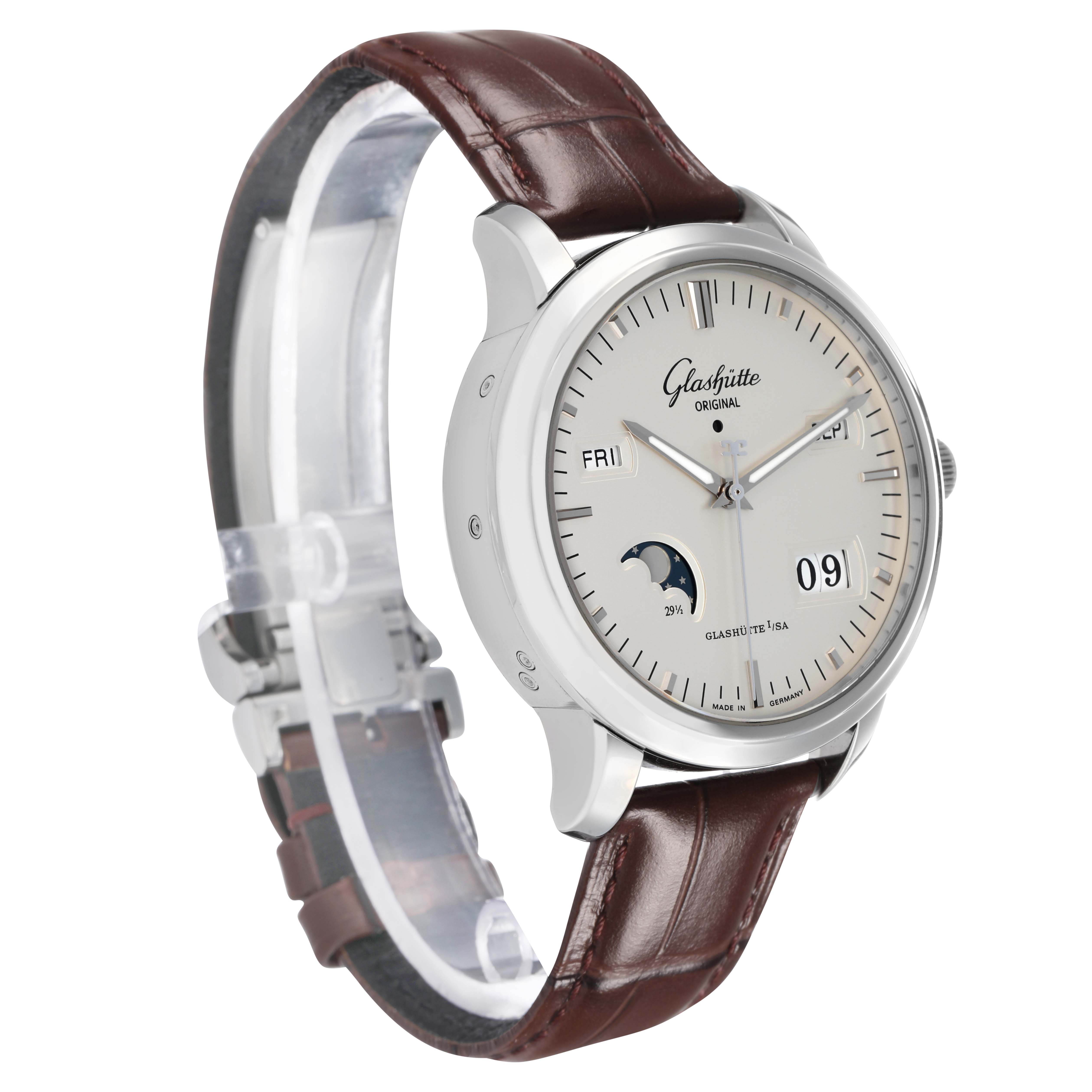 The Glashütte Senator watch is shown at a three-quarter angle, highlighting the dial, subdials, and brown leather strap.