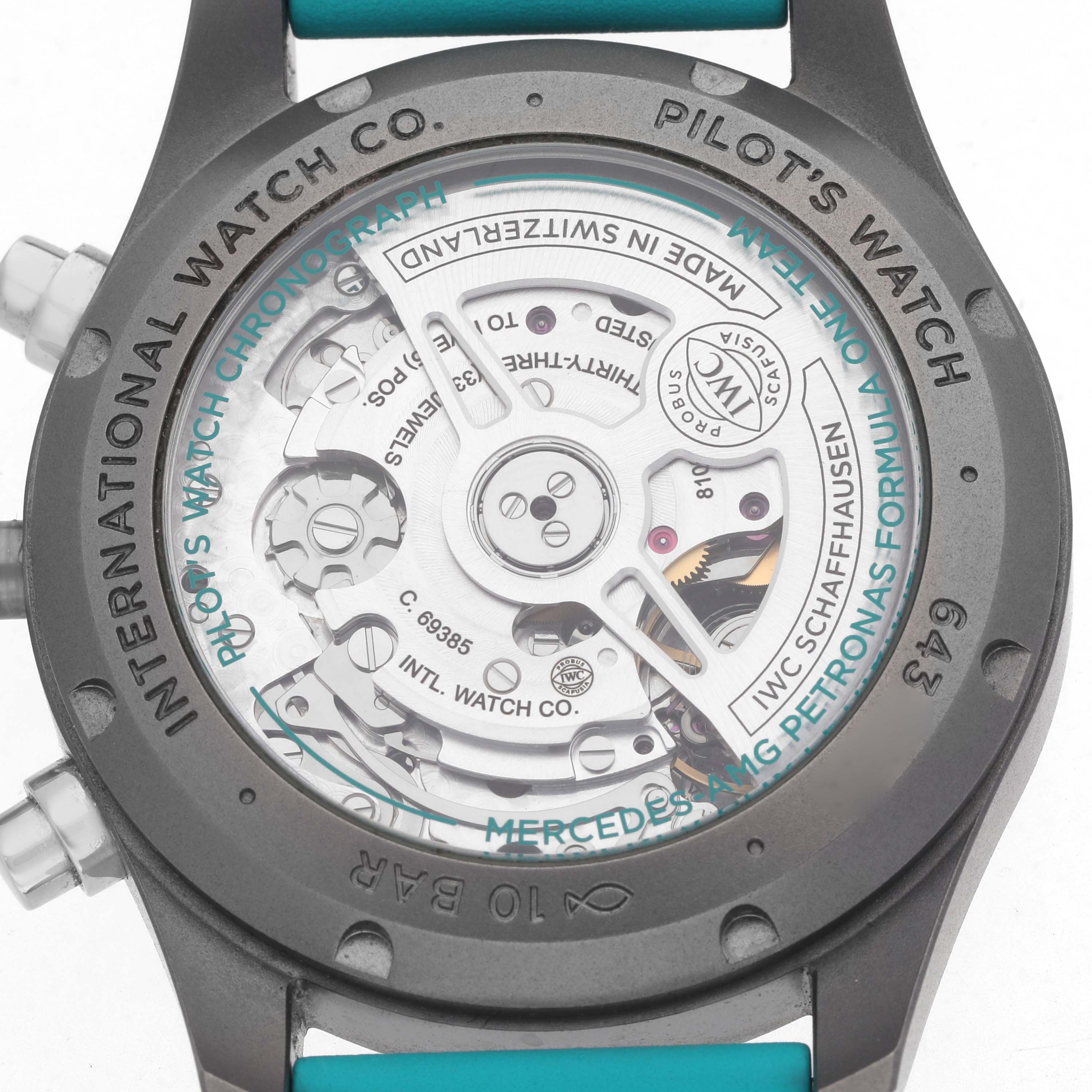 The image shows the movement and case back of the IWC Pilot IW388108 Men's Titanium Black Dial watch from directly behind.