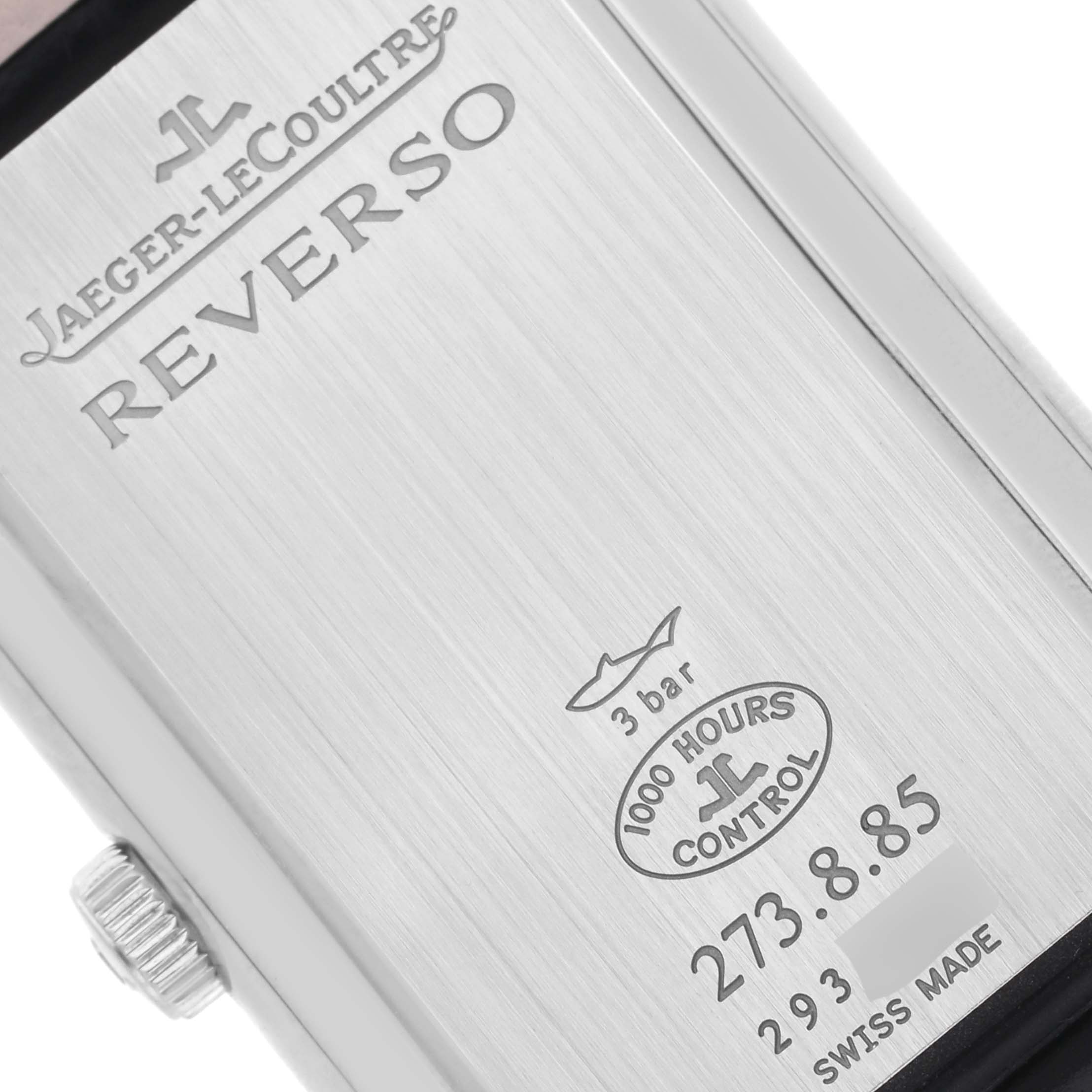 The image shows the back of the Jaeger-LeCoultre Reverso watch, highlighting branding and specifications.