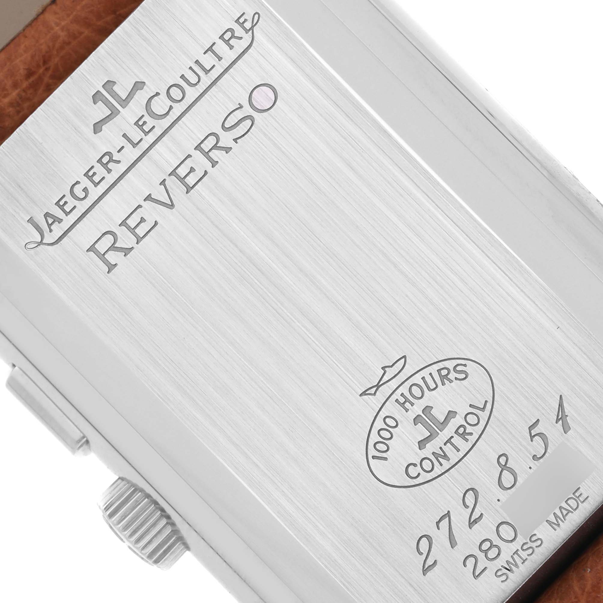 The image shows the back case of the Jaeger-LeCoultre Reverso, highlighting engravings and the crown.