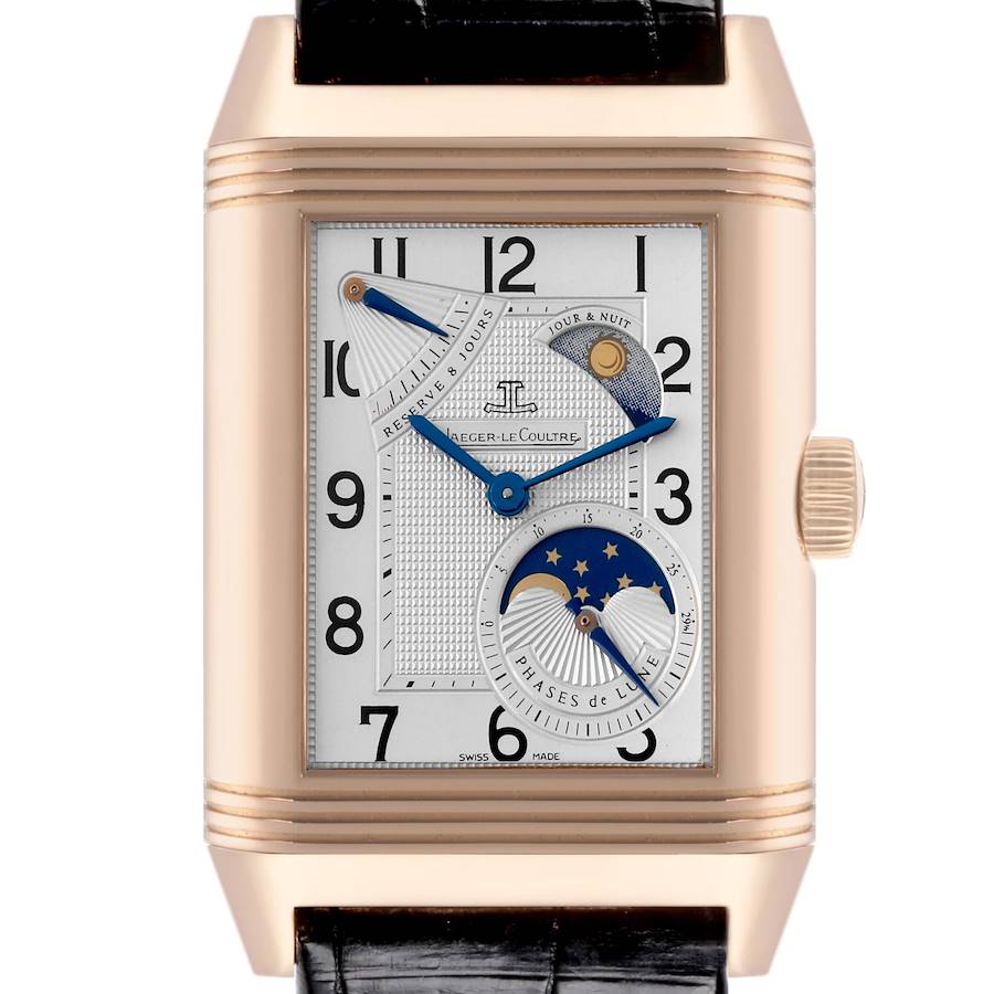 The Jaeger-LeCoultre Reverso watch is shown from the front, displaying its dial, case, moon phase, and power reserve indicators.