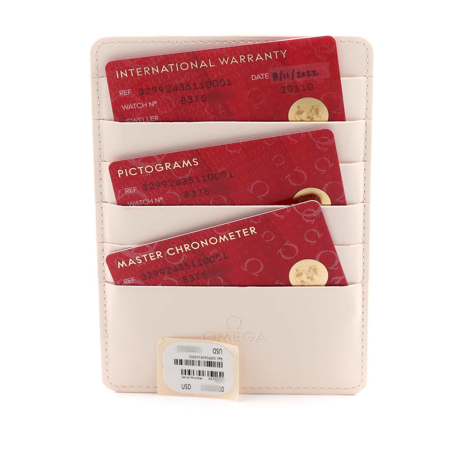 The image shows warranty cards and documents for the Omega Speedmaster 329.92.43.51.10.001 Men's Rose Gold Brown Dial, displayed in a leather holder.