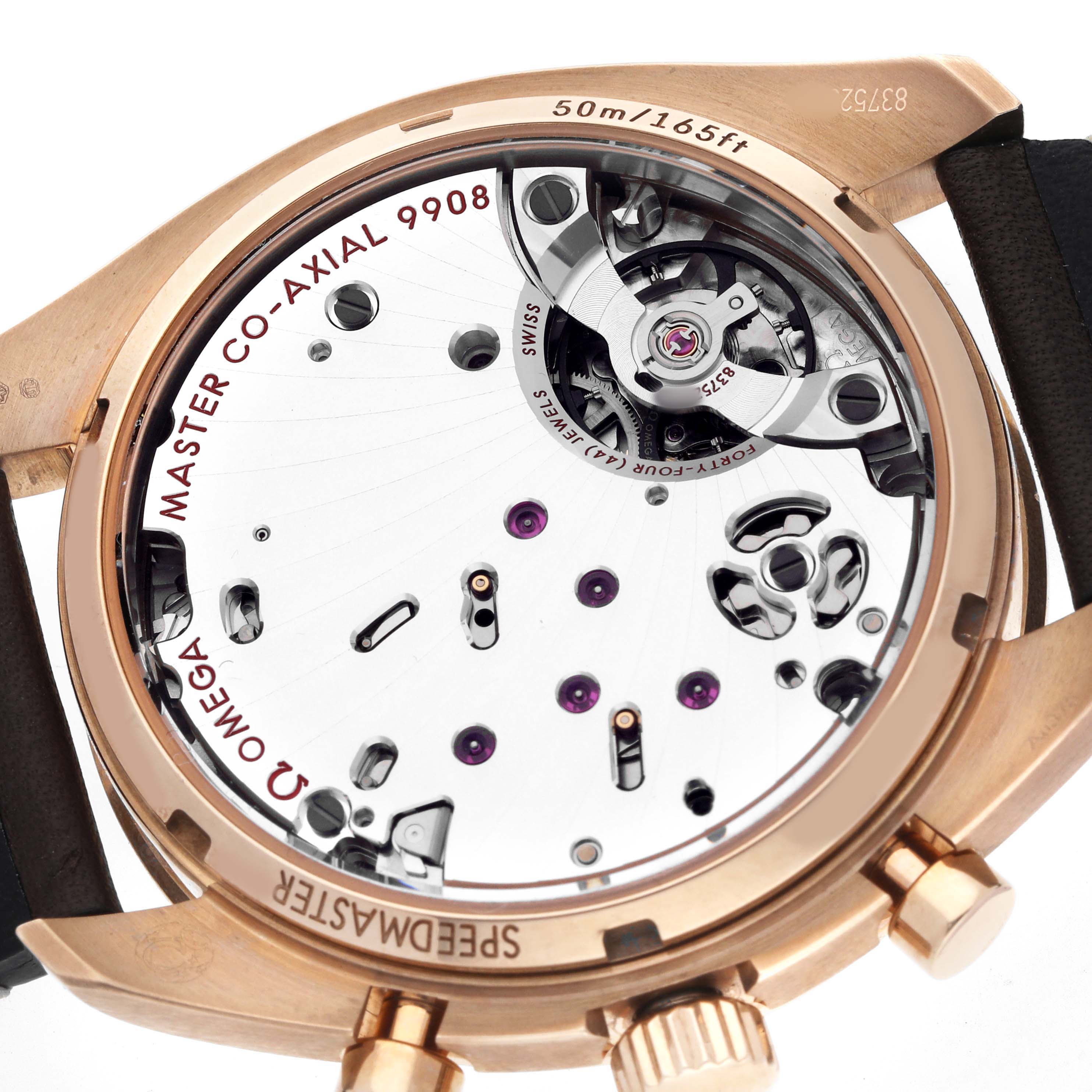 The image shows the case back of an Omega Speedmaster 329.92.43.51.10.001 Men's Rose Gold Brown Dial, highlighting its Master Co-Axial caliber and movement details.